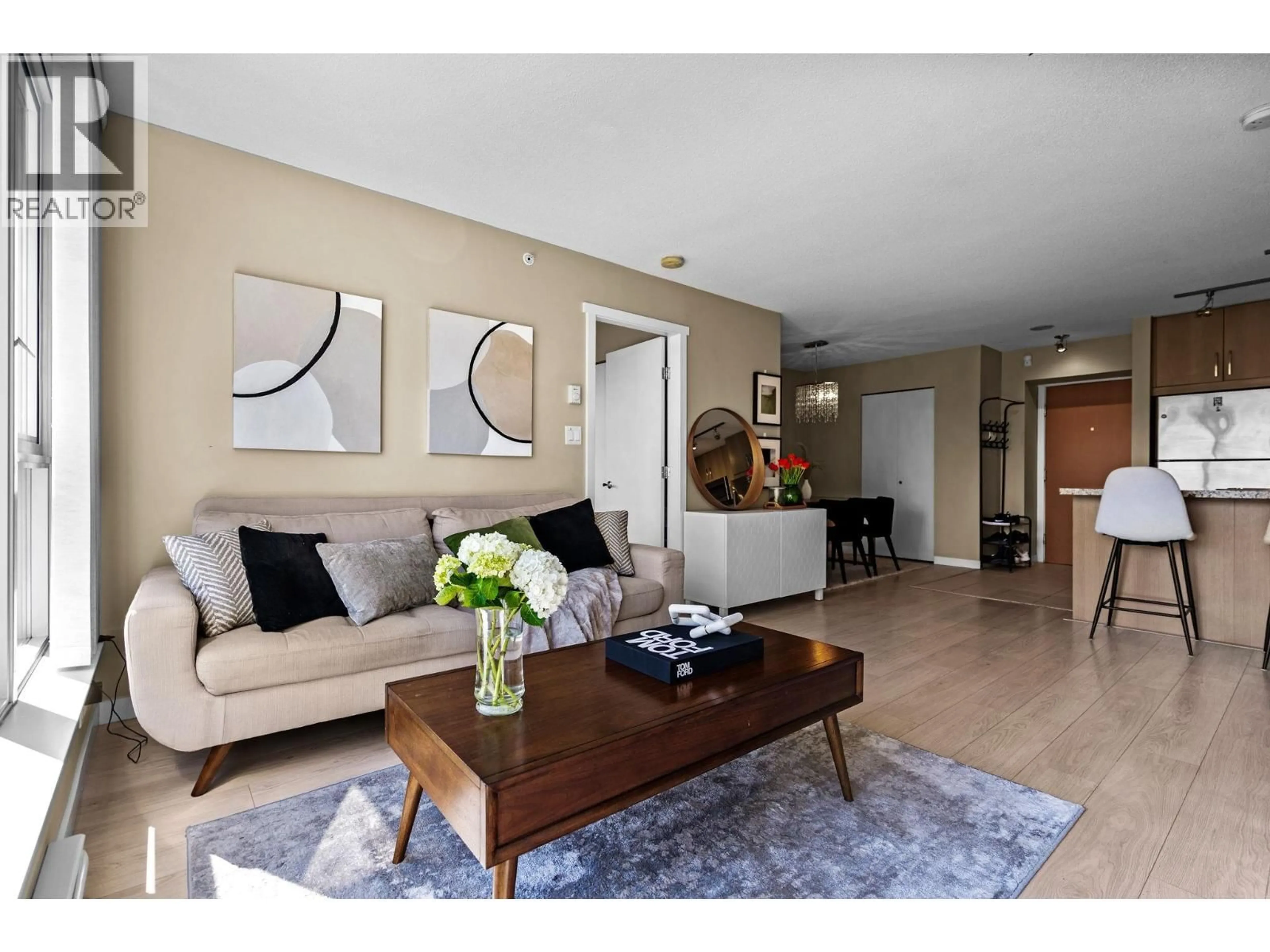 Living room with furniture, wood/laminate floor for 1009 - 660 NOOTKA WAY, Port Moody British Columbia V3H0B7