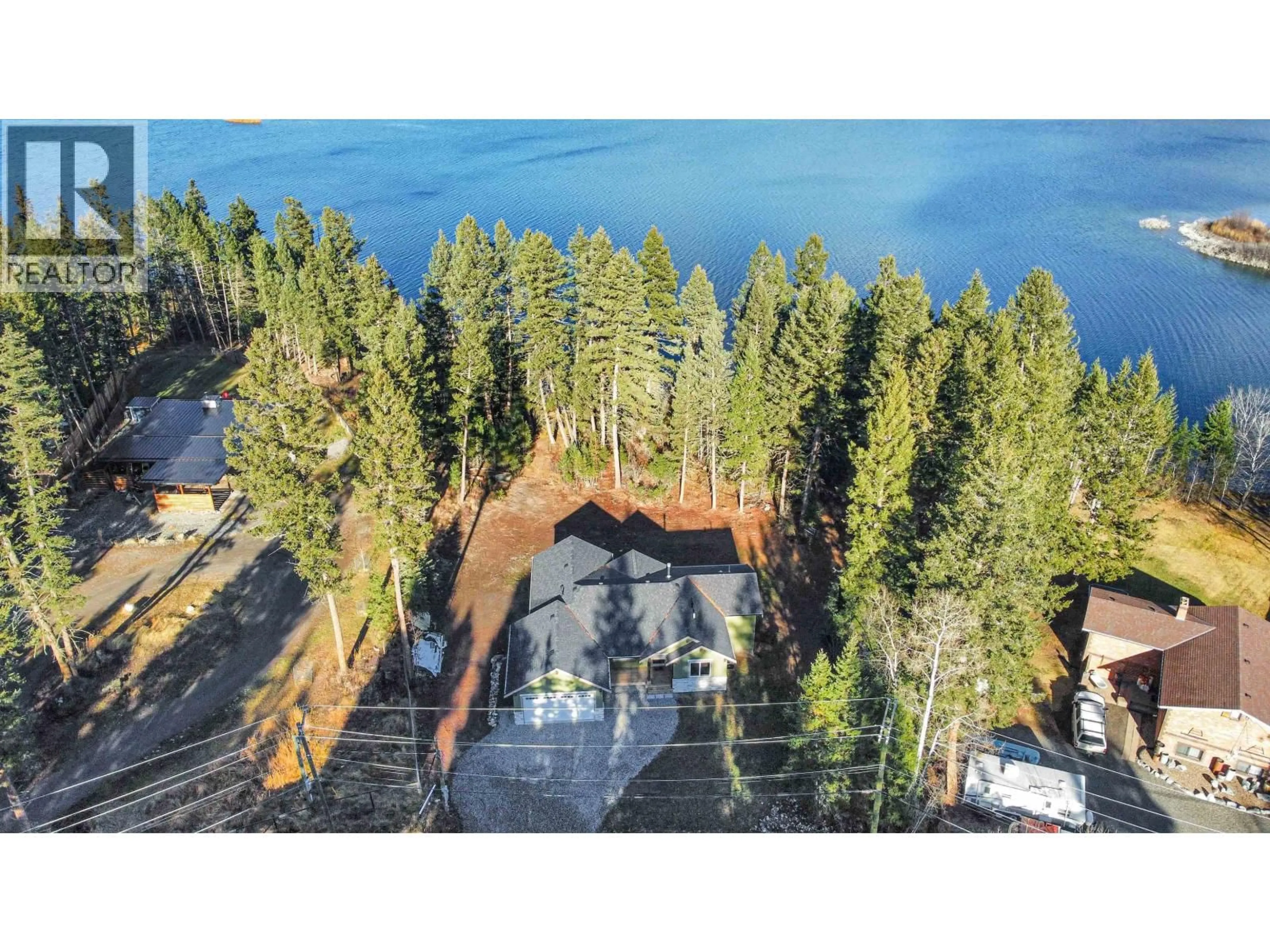 A pic from outside/outdoor area/front of a property/back of a property/a pic from drone, water/lake/river/ocean view for 5343 ANNAHAM CRESCENT, 108 Mile Ranch British Columbia V0K2Z0