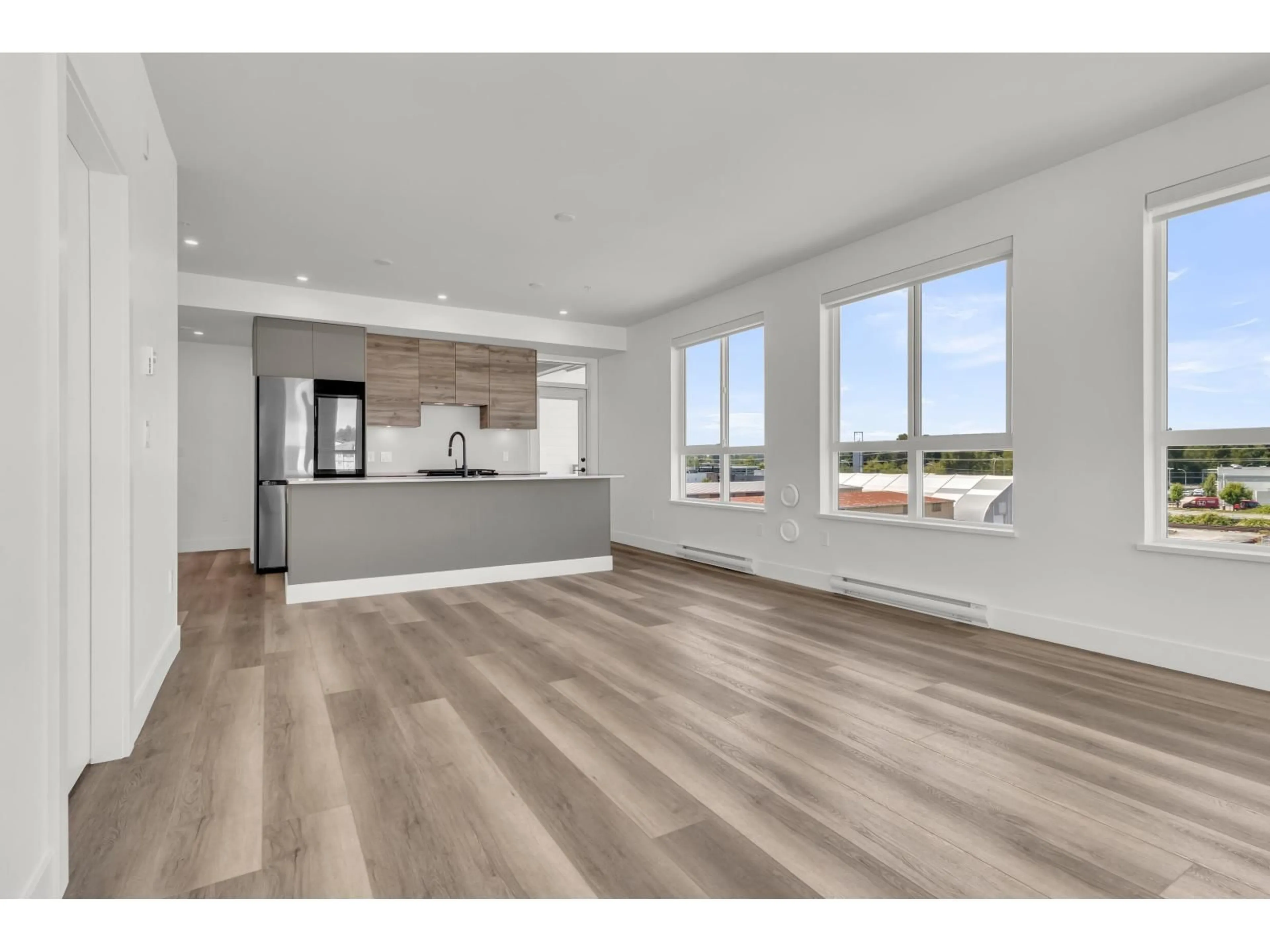 Open concept kitchen, wood/laminate floor for 511 - 30494 CARDINAL, Abbotsford British Columbia V2T0M1