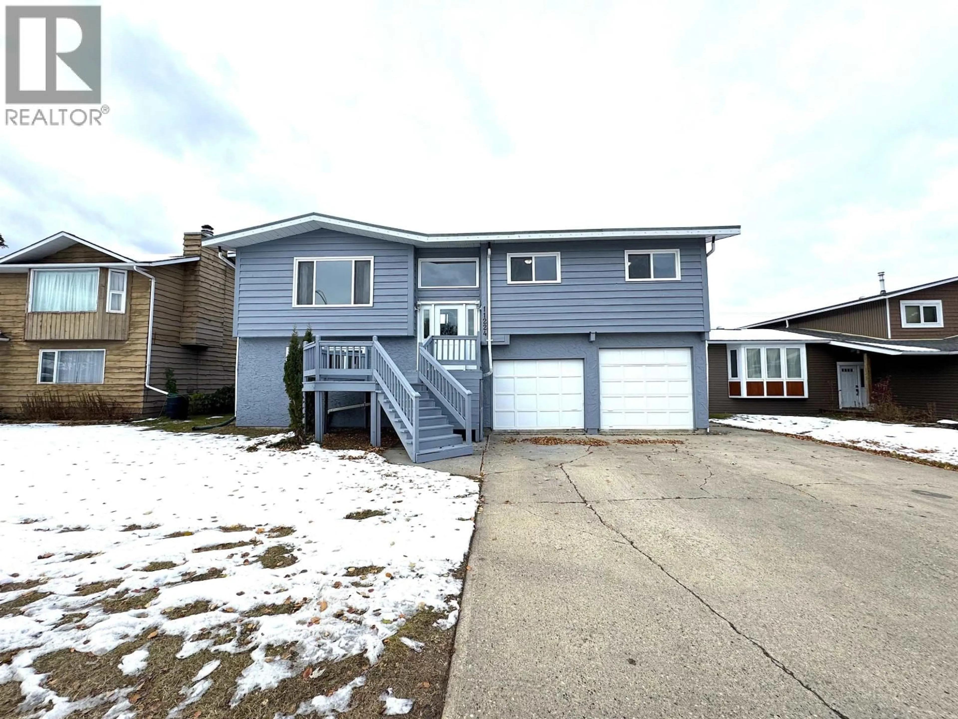 Home with vinyl exterior material, street for 11224 92 STREET, Fort St. John British Columbia V1J4Y3