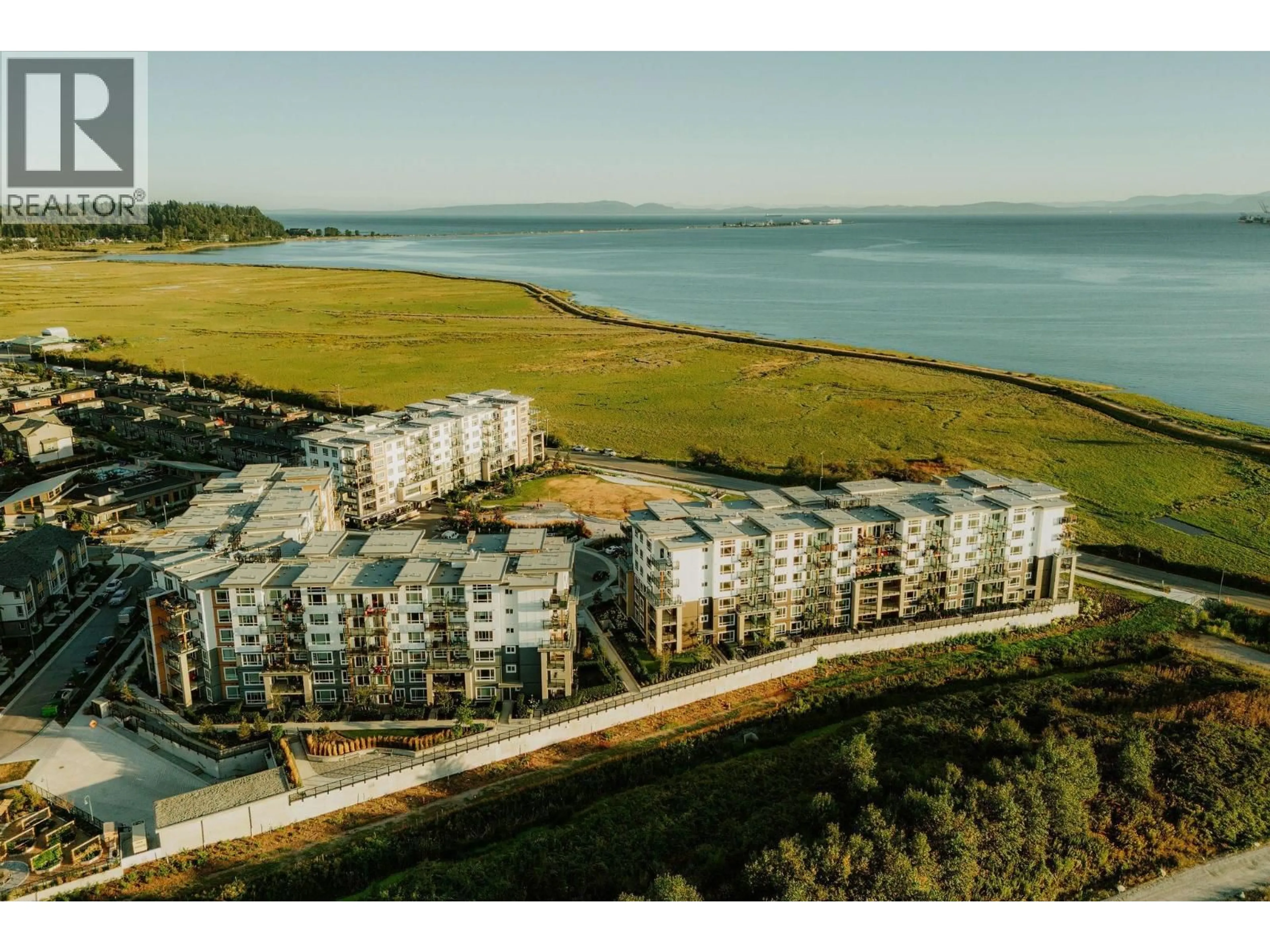 A pic from outside/outdoor area/front of a property/back of a property/a pic from drone, water/lake/river/ocean view for 304 - 2431 RABBIT DRIVE, Tsawwassen British Columbia V4M0G5