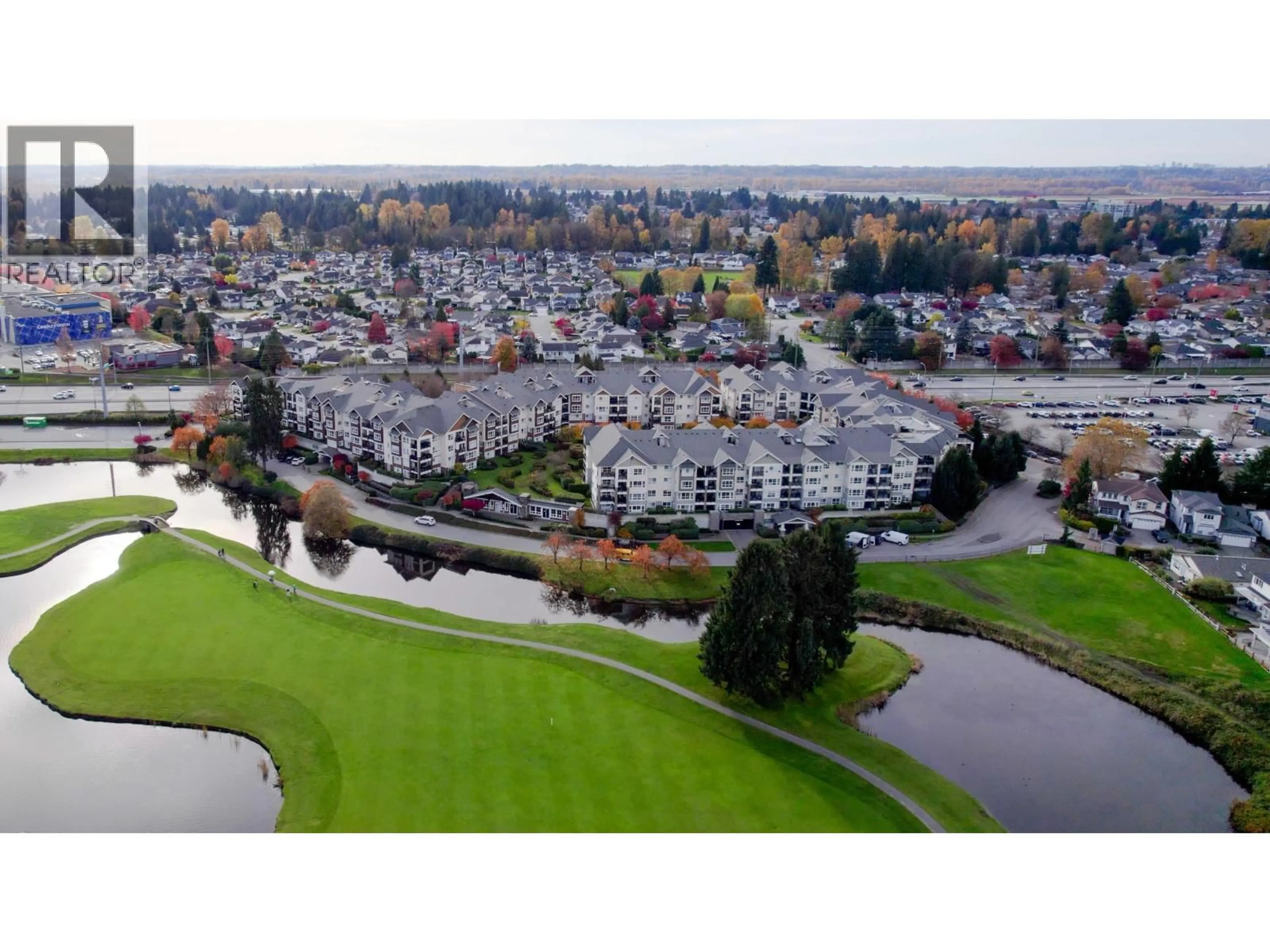 A pic from outside/outdoor area/front of a property/back of a property/a pic from drone, water/lake/river/ocean view for 211 - 19677 MEADOW GARDENS WAY, Pitt Meadows British Columbia V3Y0A2