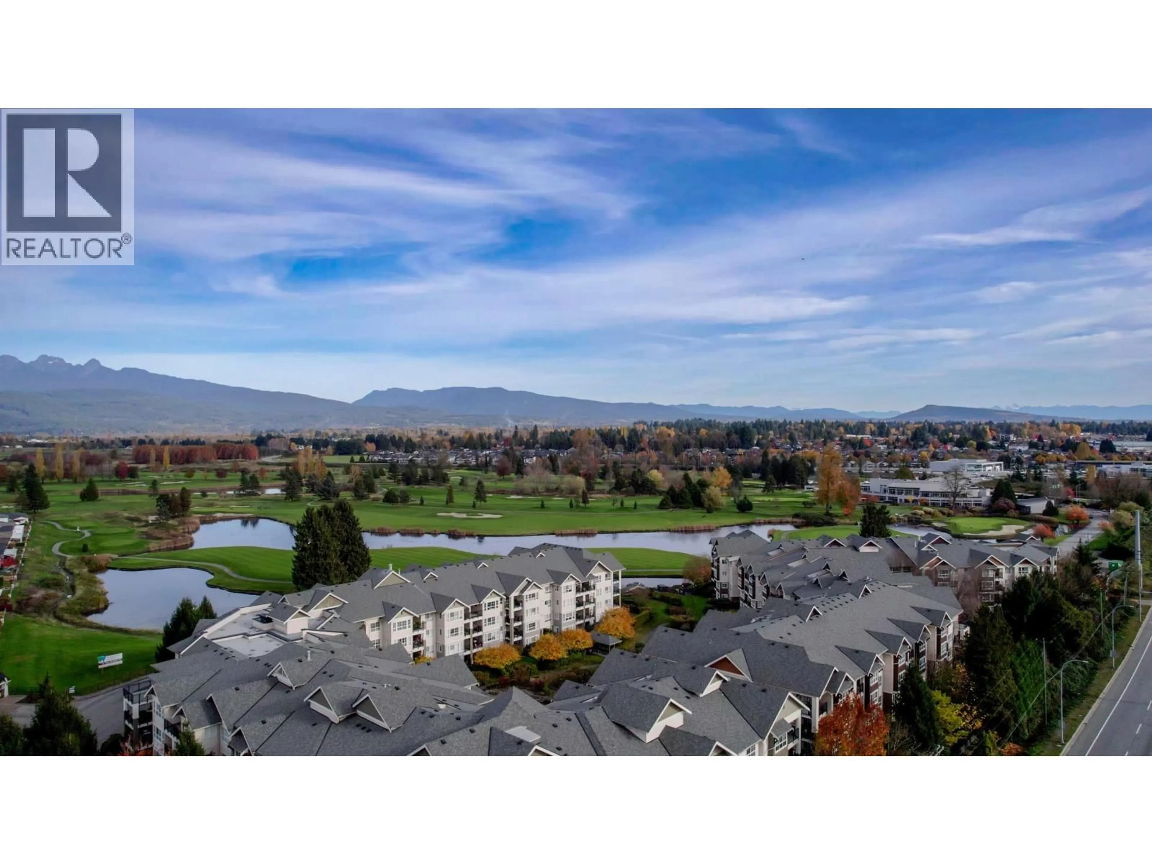 A pic from outside/outdoor area/front of a property/back of a property/a pic from drone, mountain view for 211 - 19677 MEADOW GARDENS WAY, Pitt Meadows British Columbia V3Y0A2