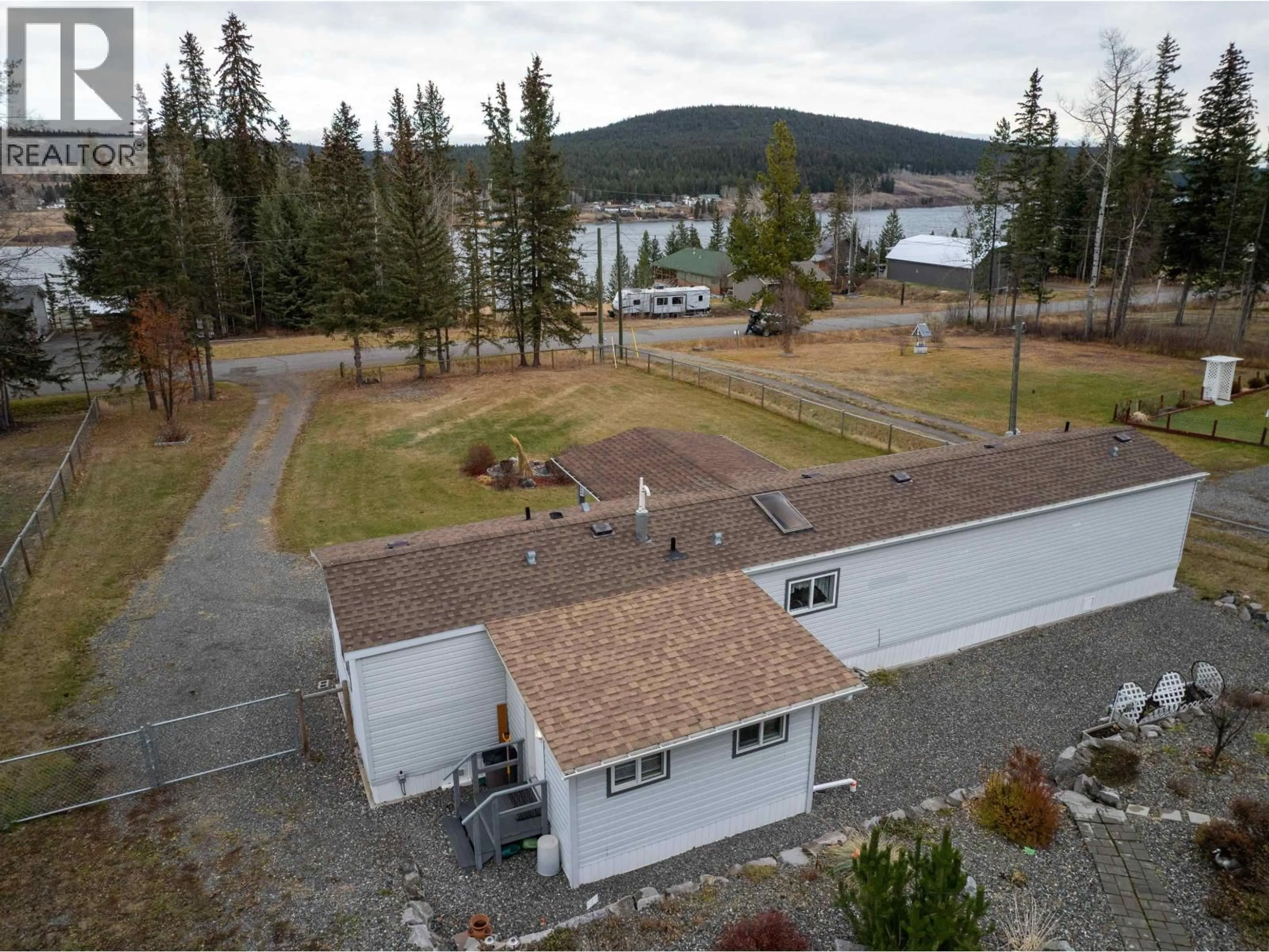 A pic from outside/outdoor area/front of a property/back of a property/a pic from drone, water/lake/river/ocean view for 6064 NORMAN ROAD, 100 Mile House British Columbia V0K2E3