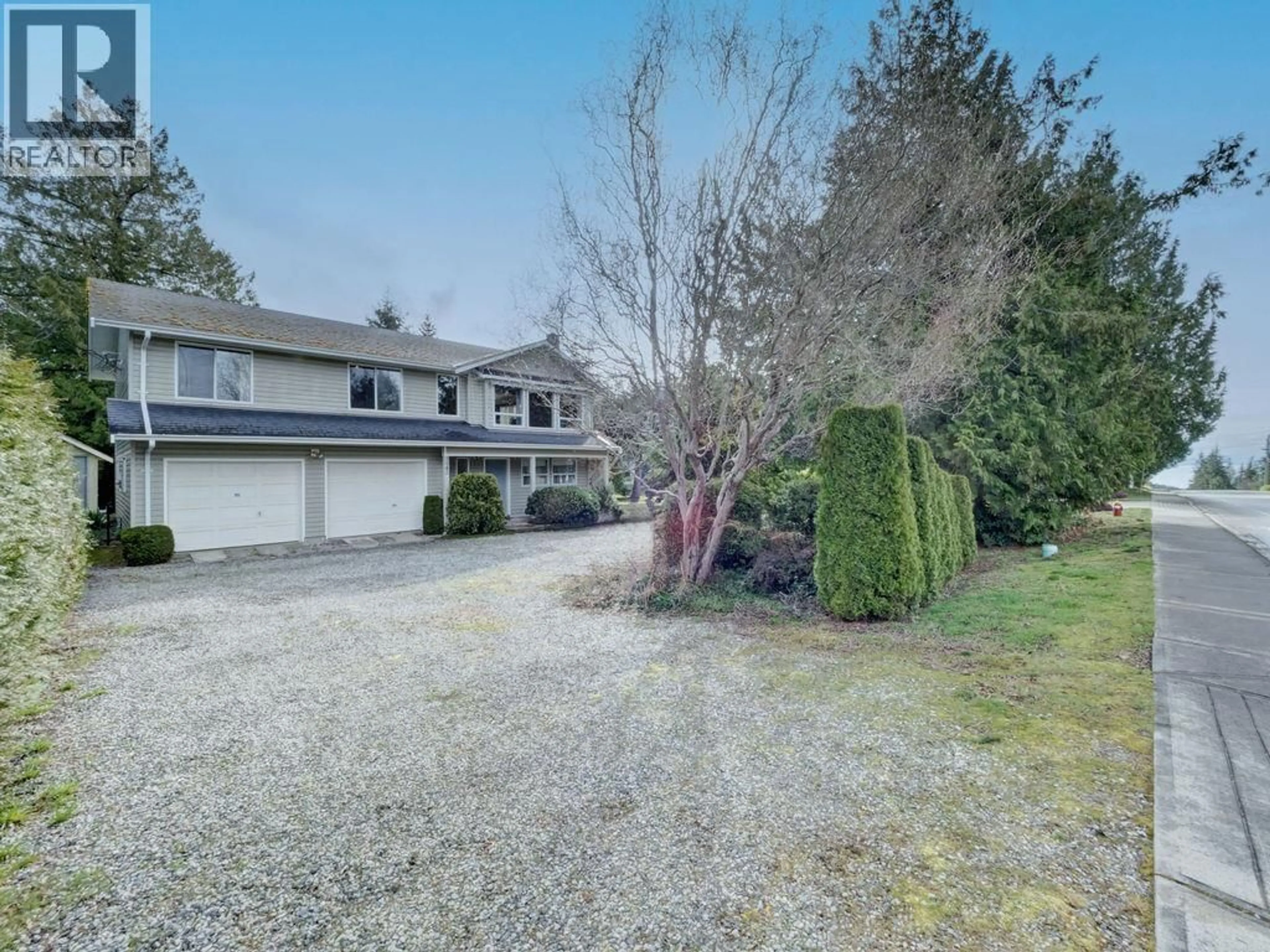 A pic from outside/outdoor area/front of a property/back of a property/a pic from drone, street for 5642 NICKERSON ROAD, Sechelt British Columbia V7Z0M6