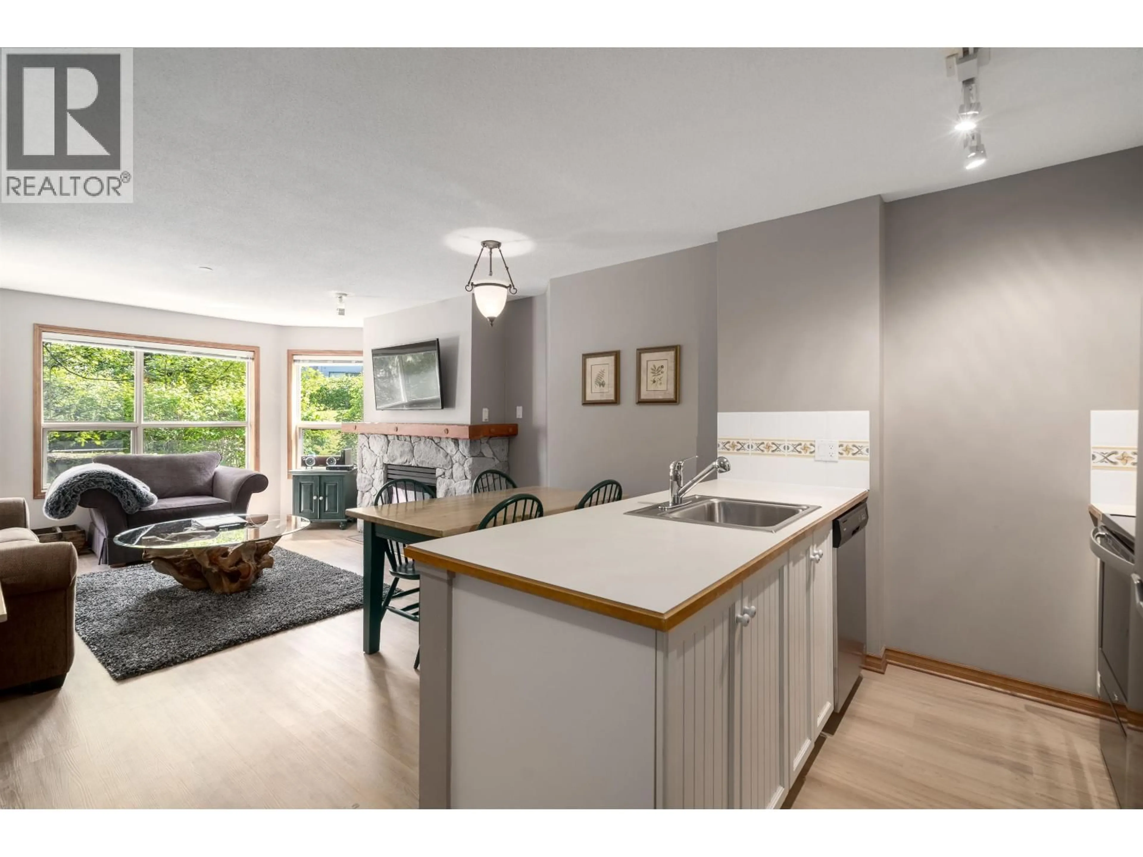 Open concept kitchen, wood/laminate floor for 243 - 4800 SPEARHEAD DRIVE, Whistler British Columbia V0N1B4