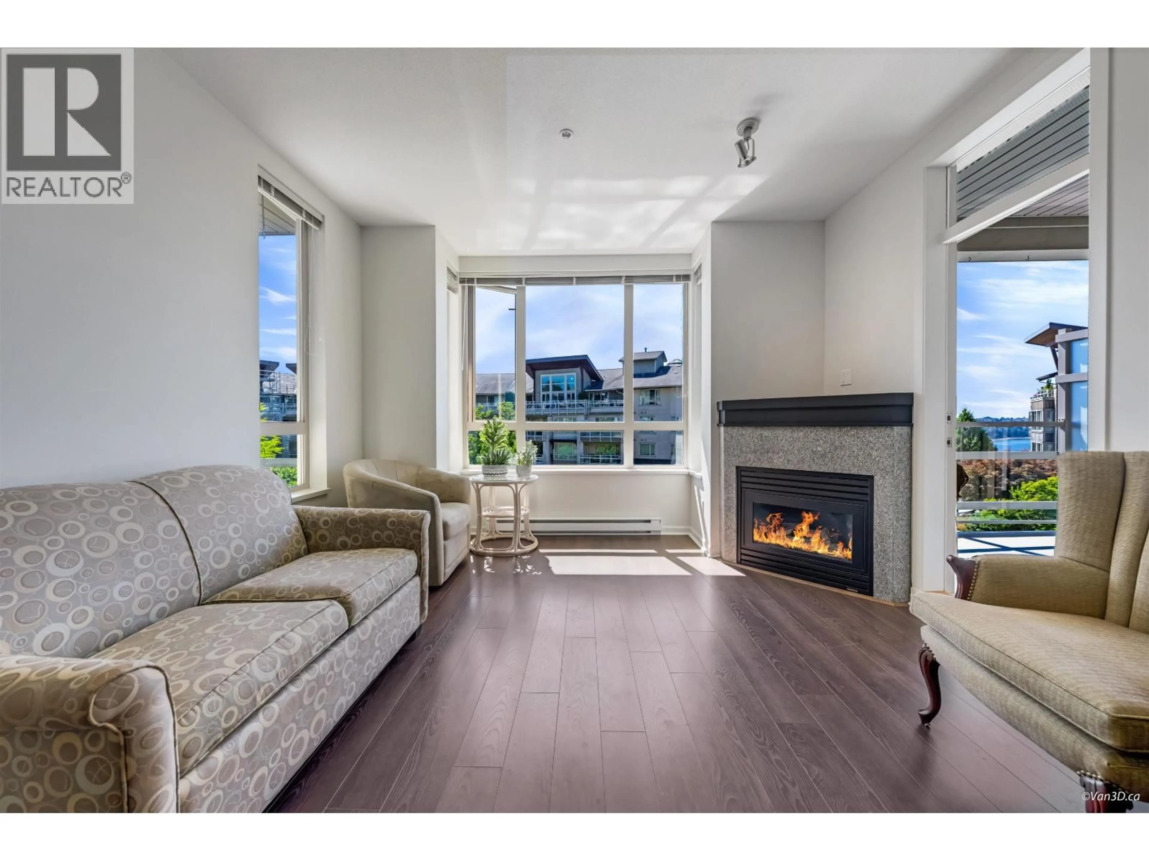 Living room with furniture, wood/laminate floor for 309 - 580 RAVEN WOODS DRIVE, North Vancouver British Columbia V7G2T2