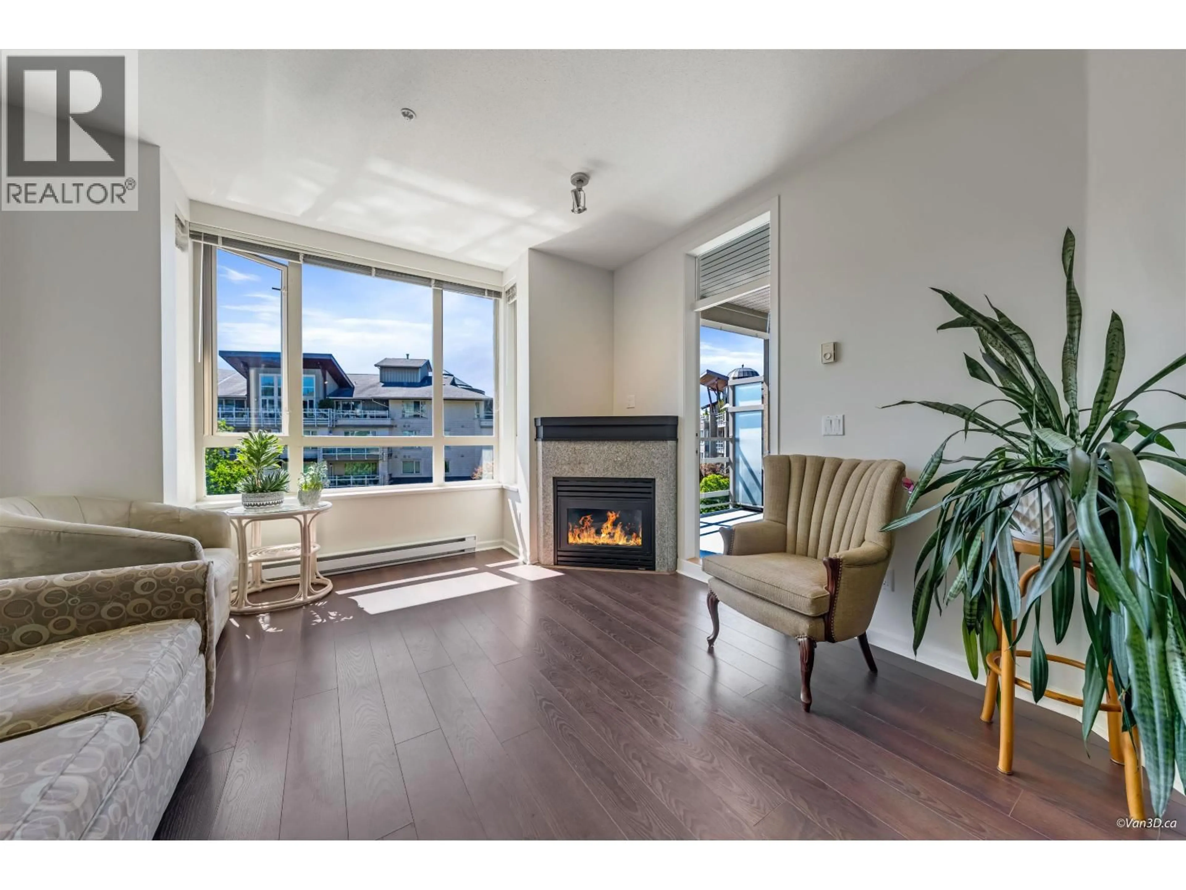 Living room with furniture, wood/laminate floor for 309 - 580 RAVEN WOODS DRIVE, North Vancouver British Columbia V7G2T2