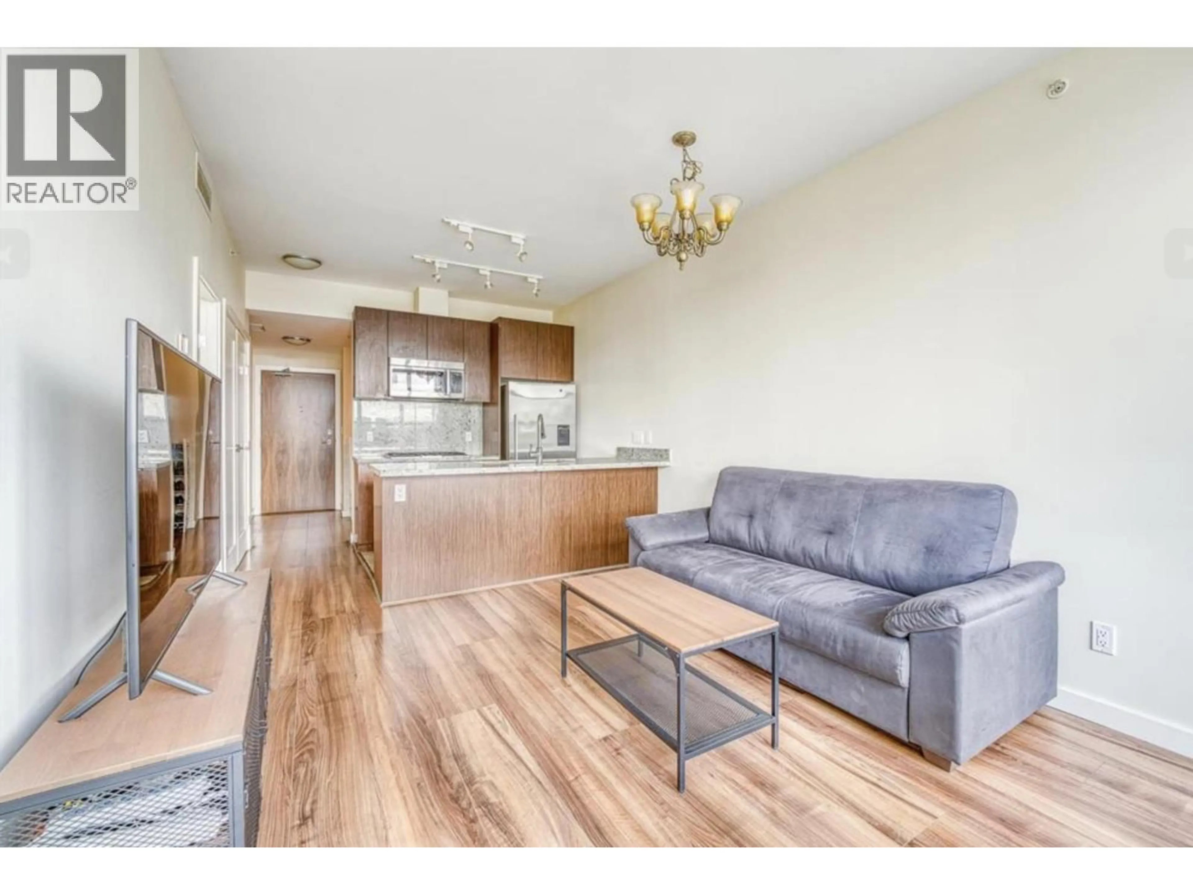 Living room with furniture, wood/laminate floor for 305 - 8633 CAPSTAN WAY, Richmond British Columbia V6X0N5