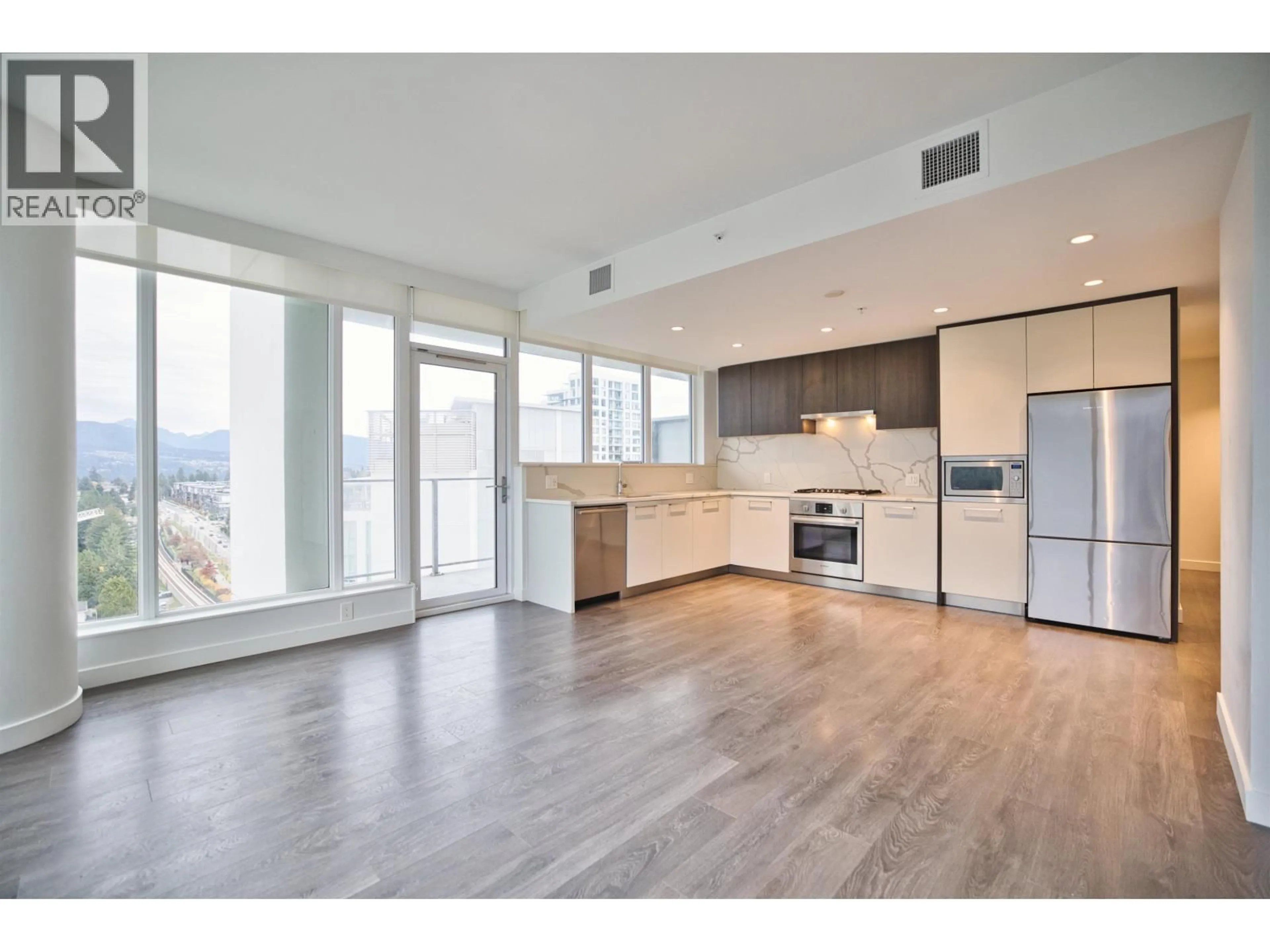 Open concept kitchen, wood/laminate floor for 1604 - 567 CLARKE ROAD, Coquitlam British Columbia V3J0K7