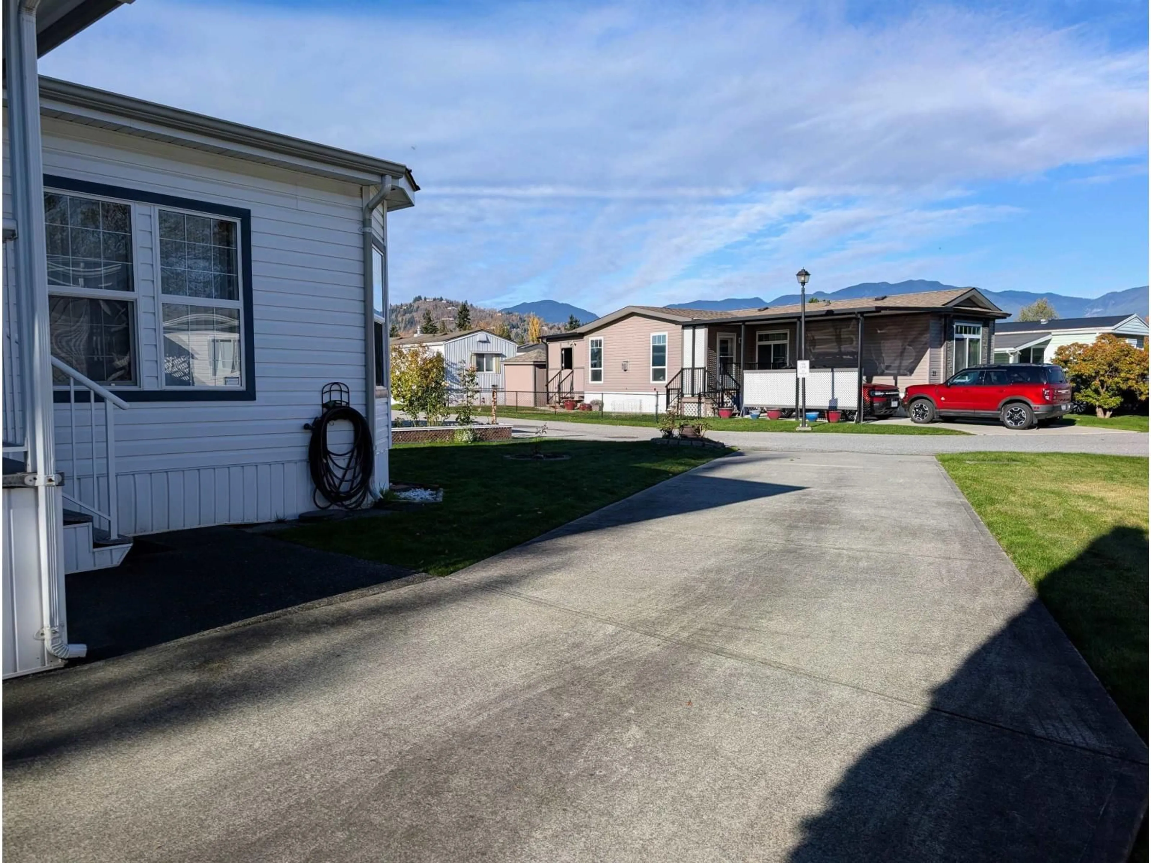 A pic from outside/outdoor area/front of a property/back of a property/a pic from drone, street for 22 - 7610 EVANS ROAD, Chilliwack British Columbia V2R2T4