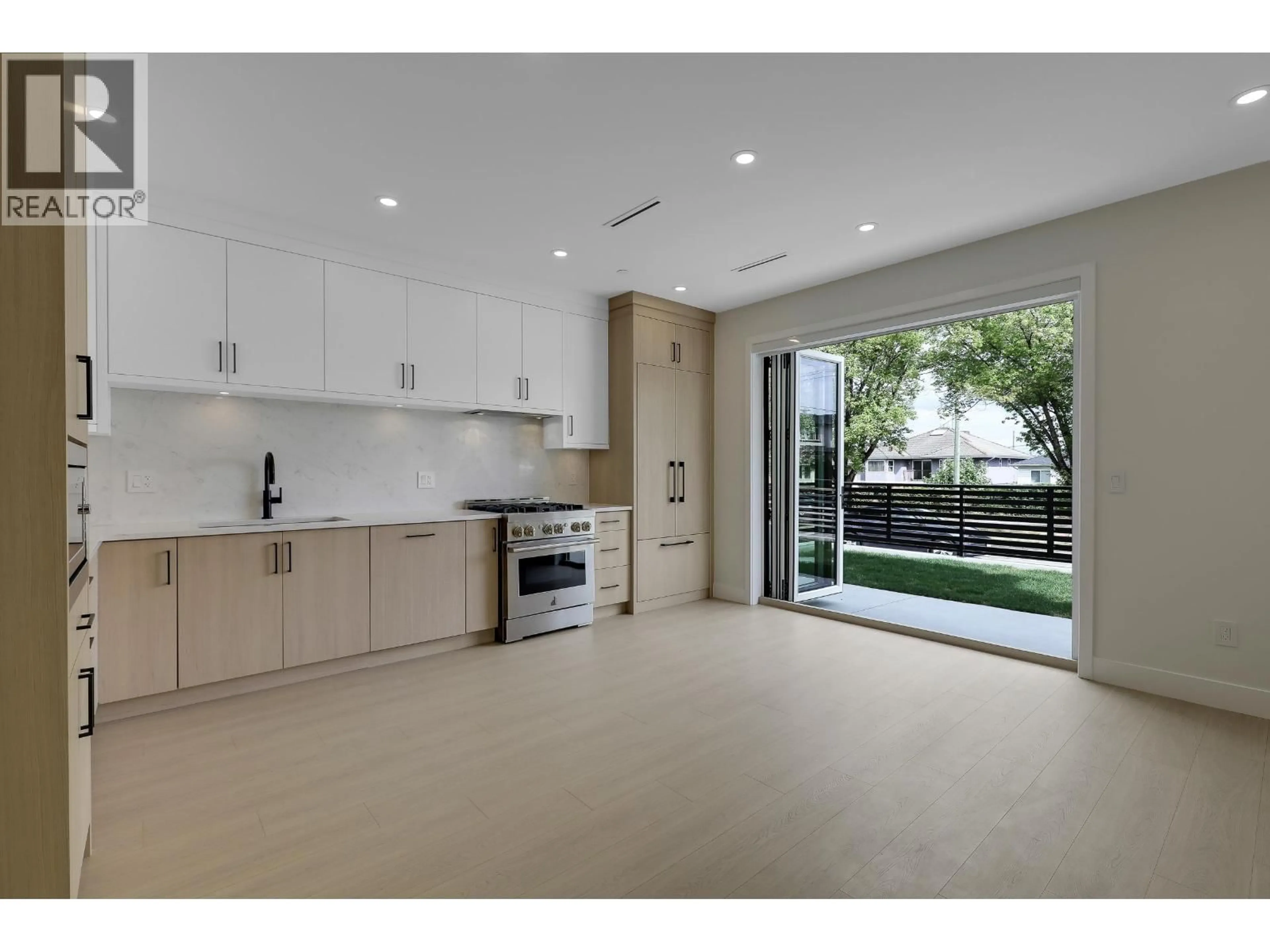 Open concept kitchen, ceramic/tile floor for 1 - 3695 26 AVENUE, Vancouver British Columbia V5R2M7