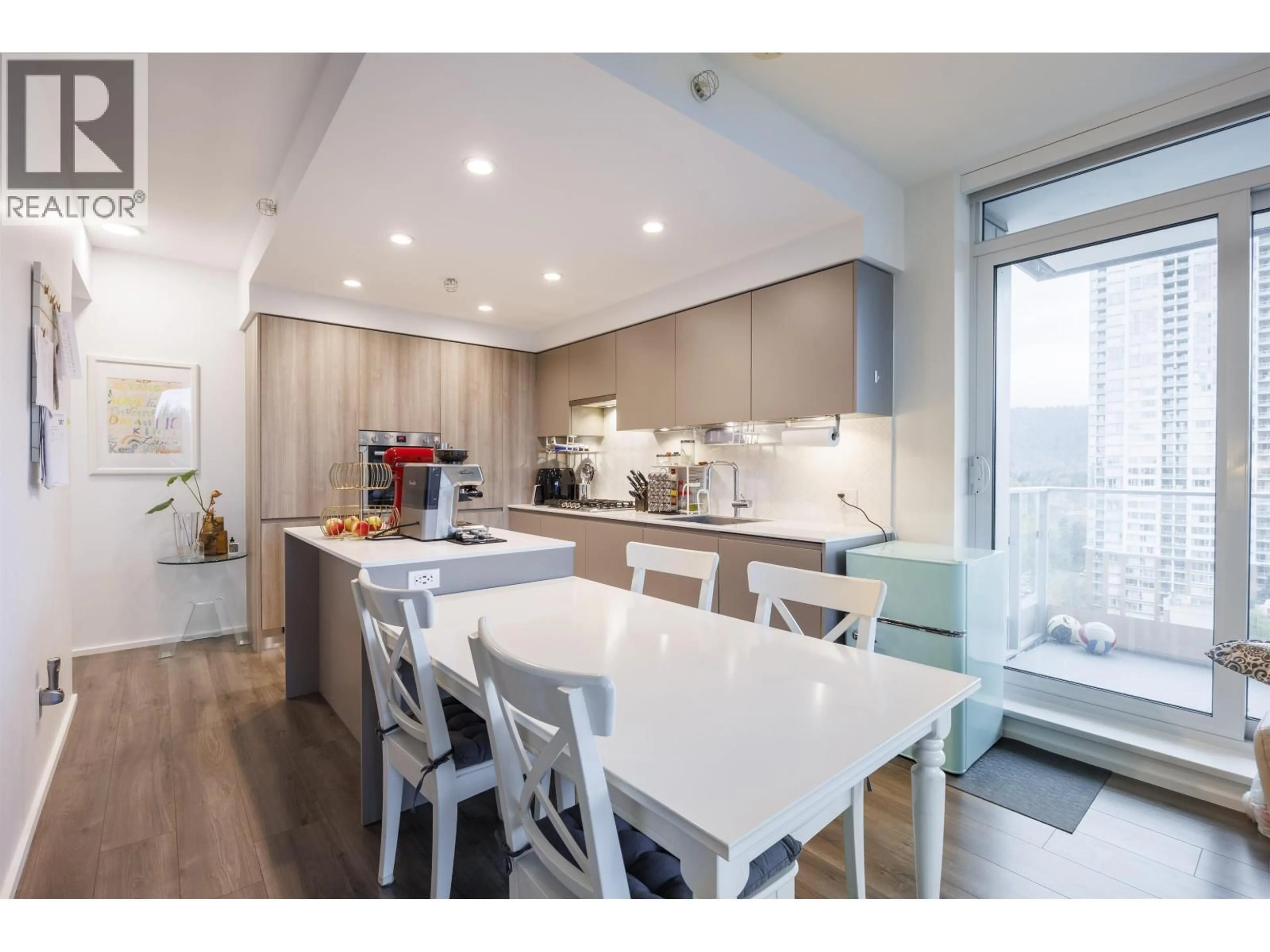 Open concept kitchen, wood/laminate floor for 1301 - 3809 EVERGREEN PLACE, Burnaby British Columbia V3J0M1