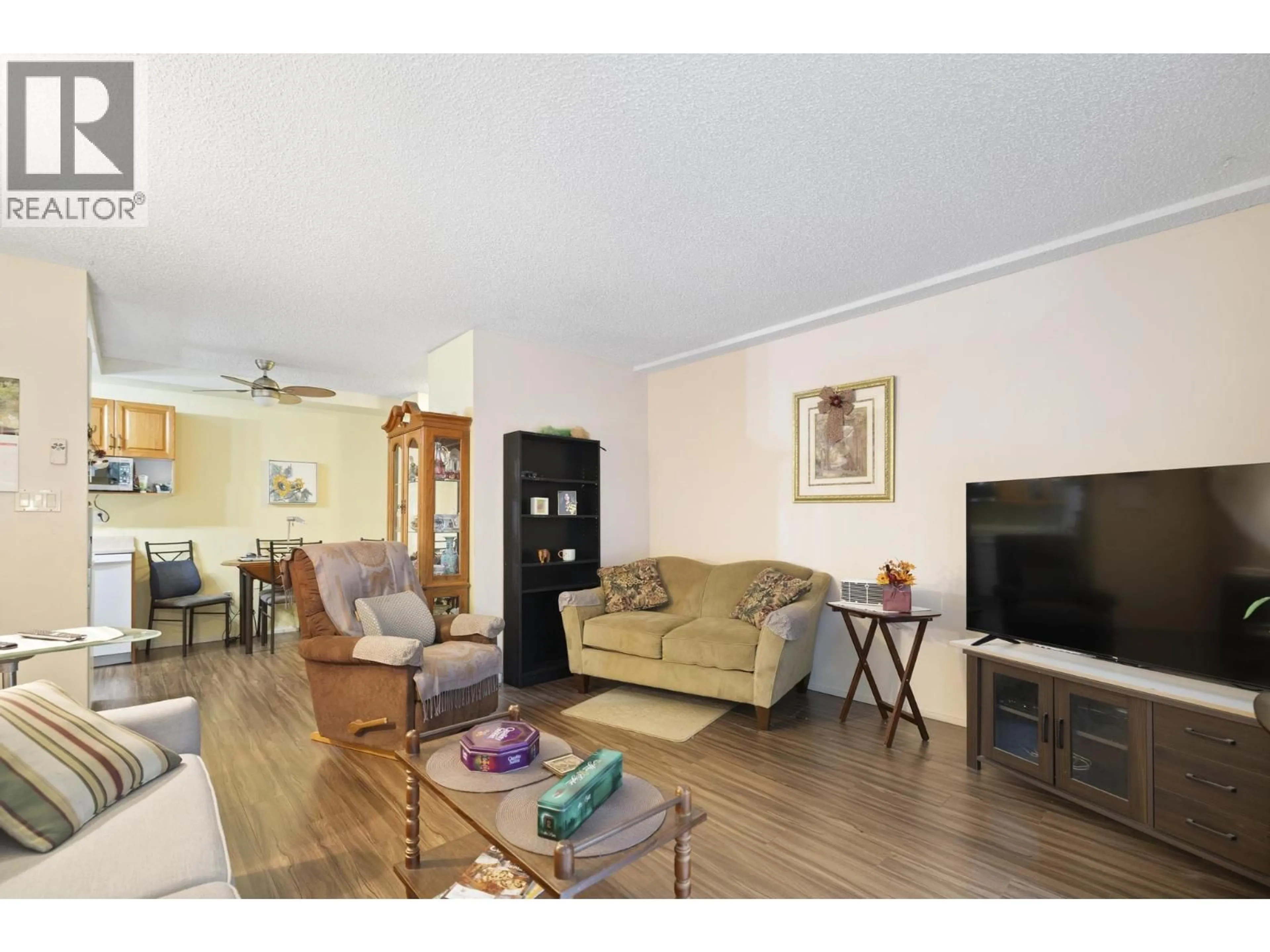 Living room with furniture, wood/laminate floor for 116 - 7240 LINDSAY ROAD, Richmond British Columbia V7C3M6
