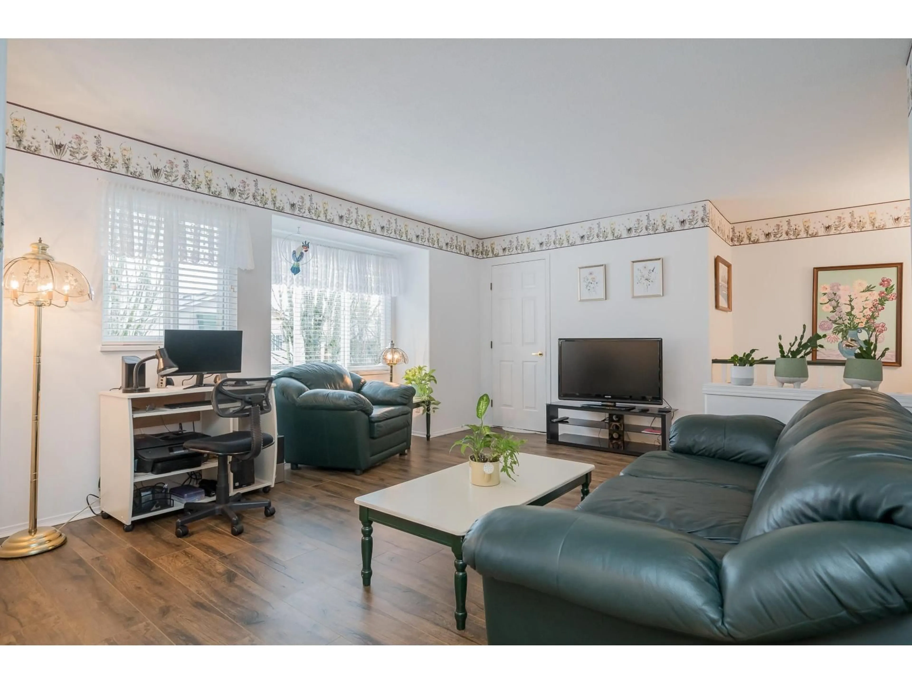 Living room with furniture, wood/laminate floor for 238 - 13888 70, Surrey British Columbia V3W0R8