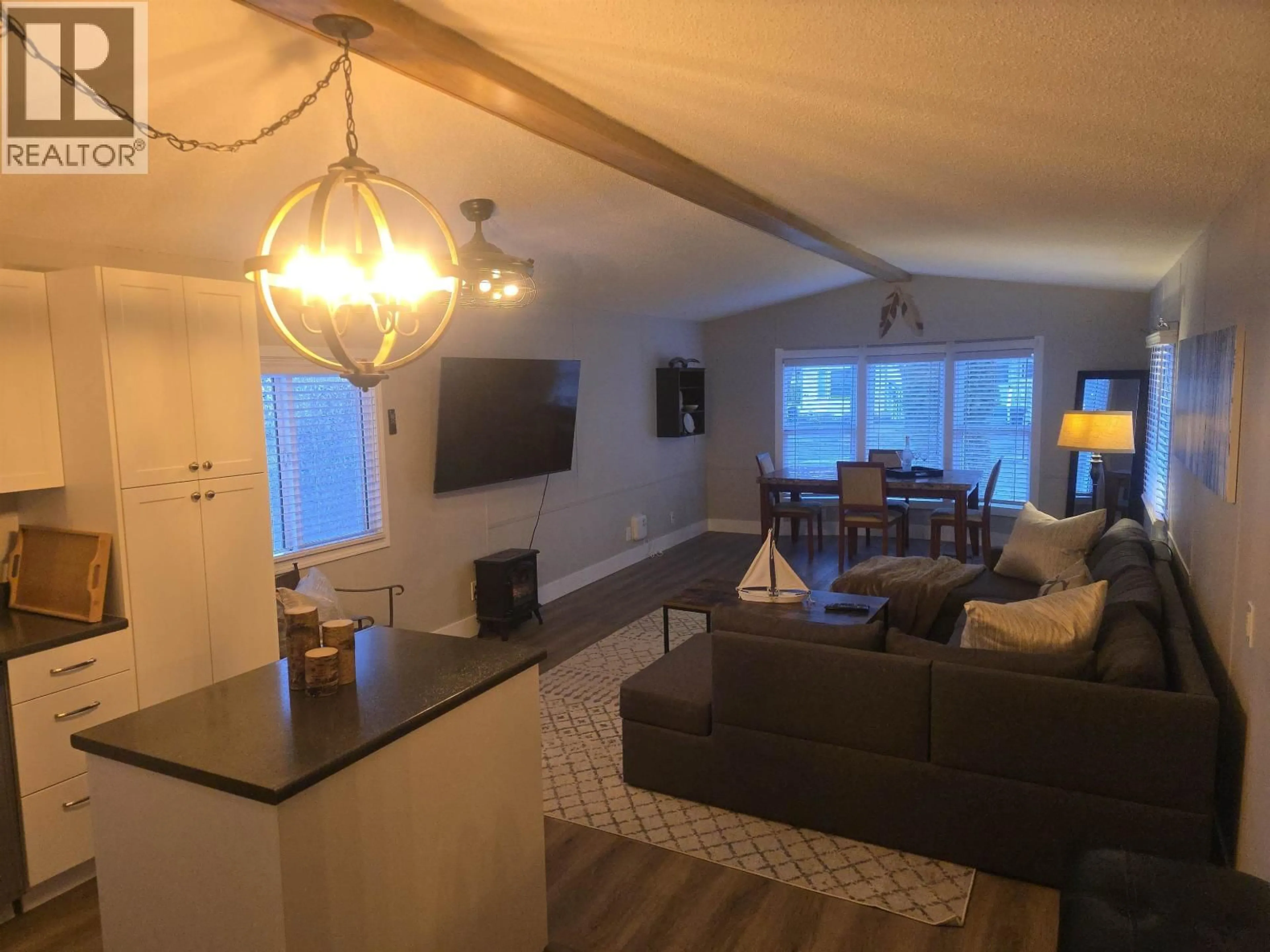 Living room with furniture, wood/laminate floor for 141 - 1000 INVERNESS ROAD, Prince George British Columbia V2K4V1