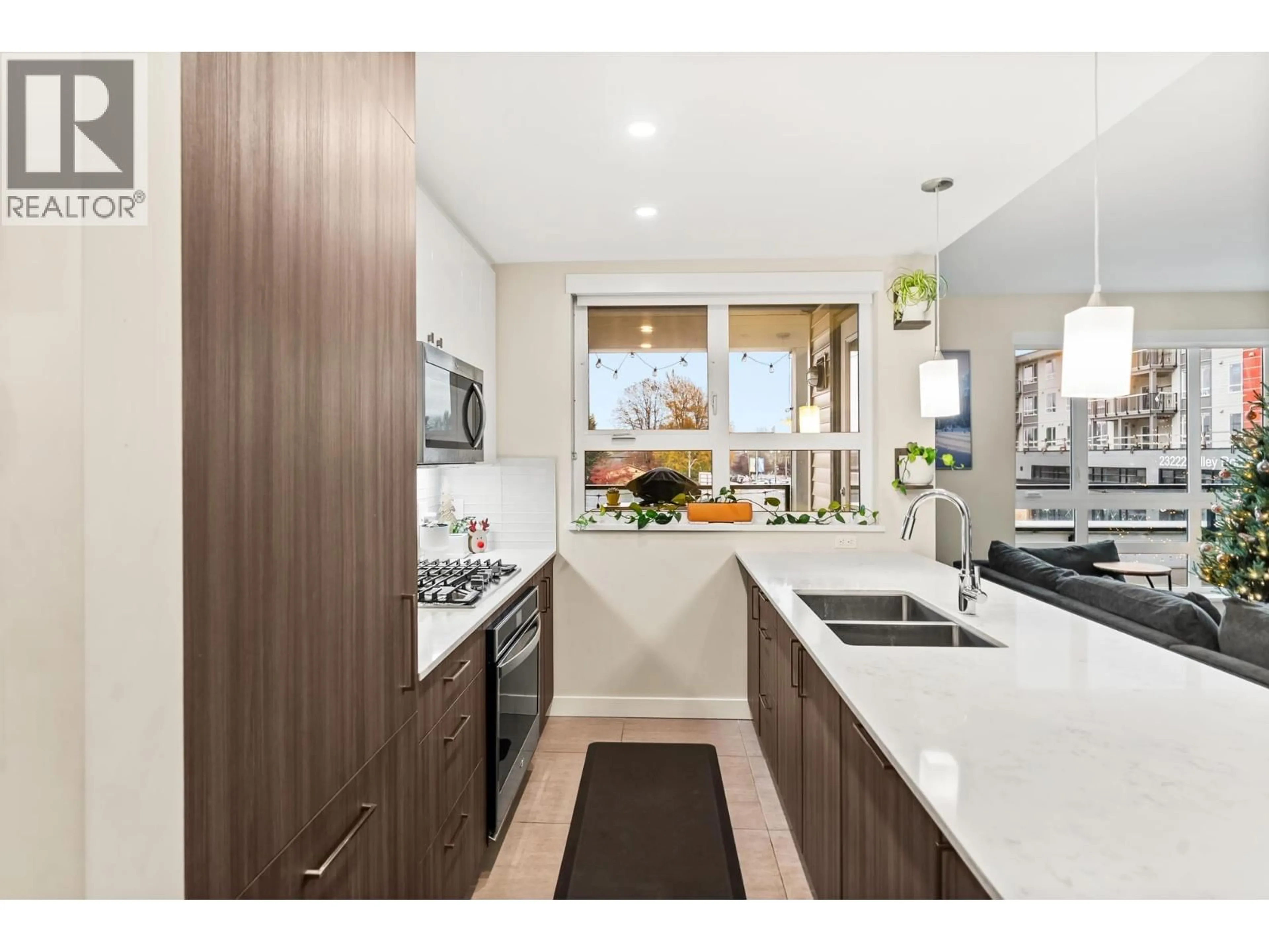 Contemporary kitchen, wood/laminate floor for 203 - 23233 GILLEY ROAD, Richmond British Columbia V6V1E6