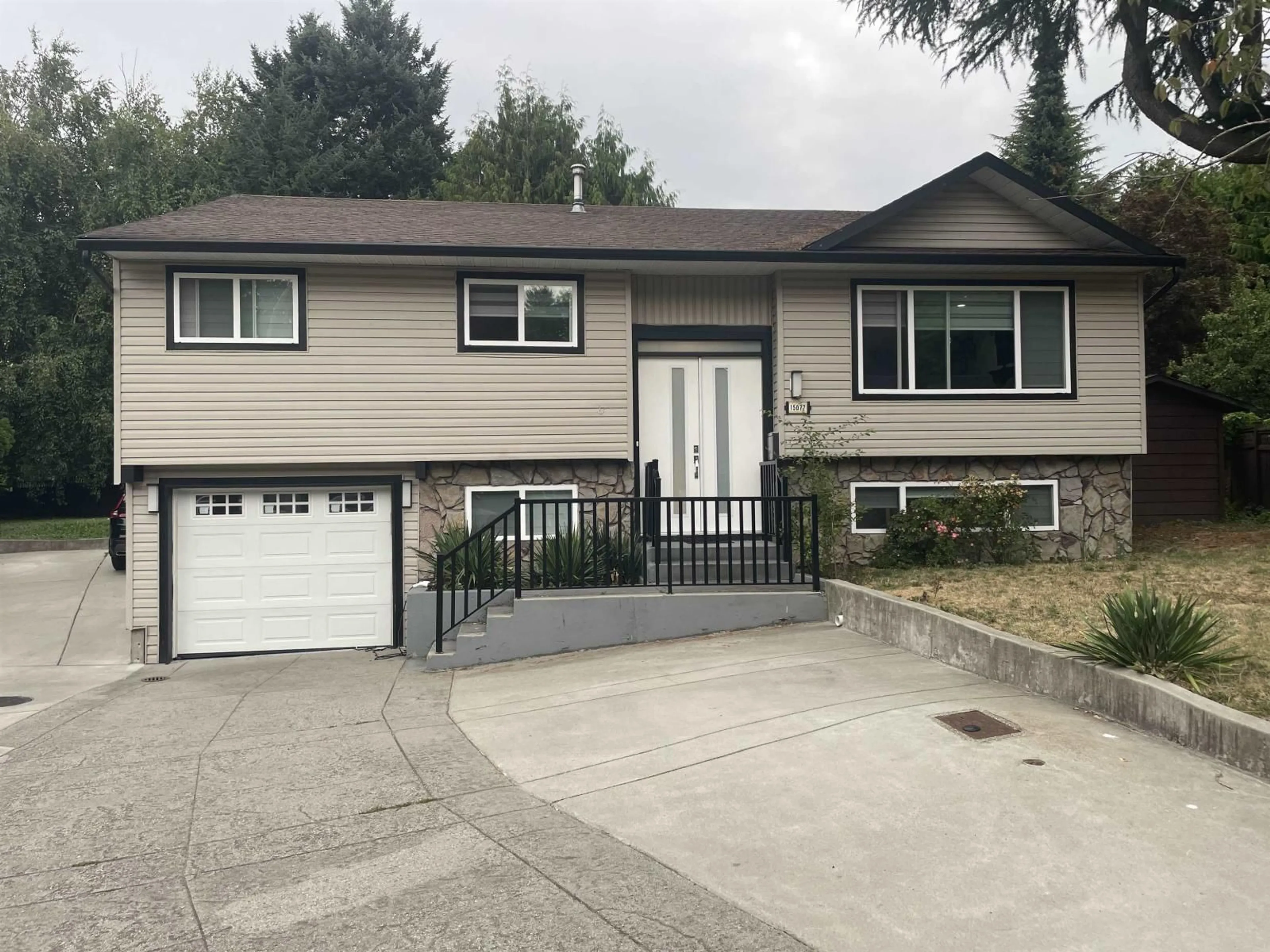 Home with vinyl exterior material, street for 15077 86B, Surrey British Columbia V3S4V3