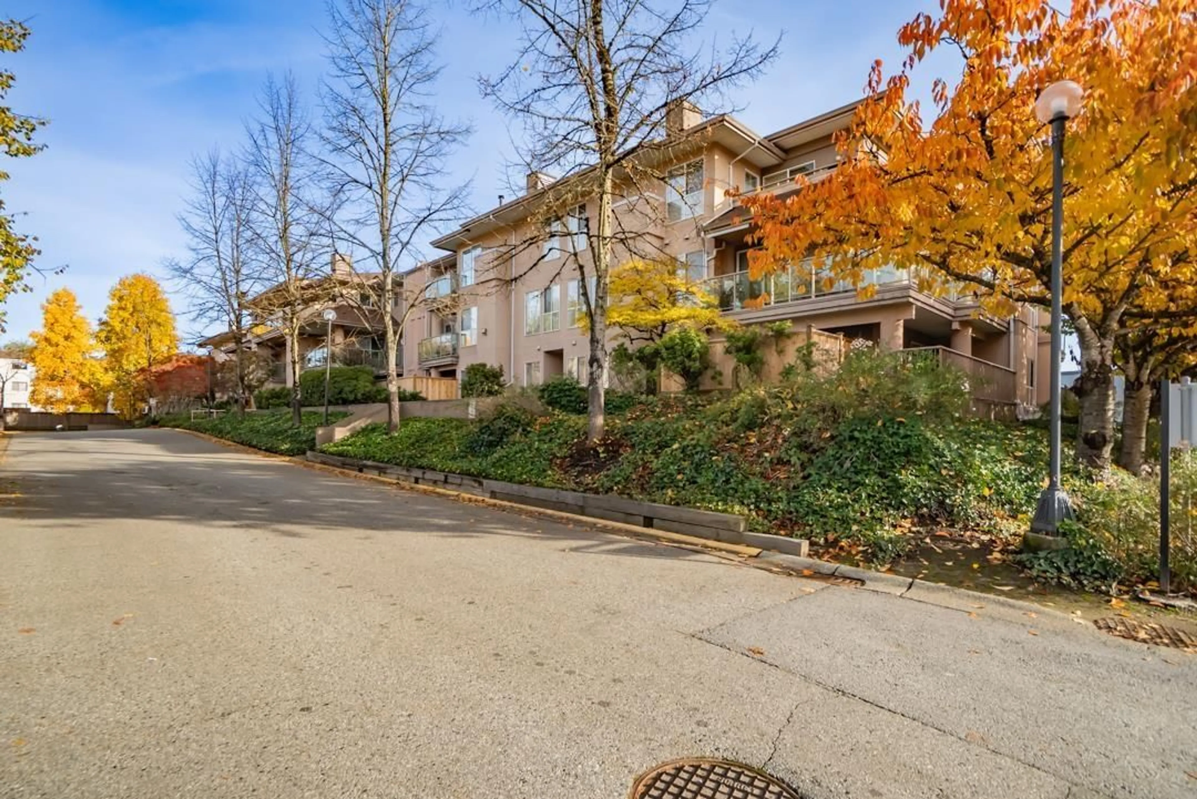 A pic from outside/outdoor area/front of a property/back of a property/a pic from drone, street for 209 - 14993 101A, Surrey British Columbia V3R0T1