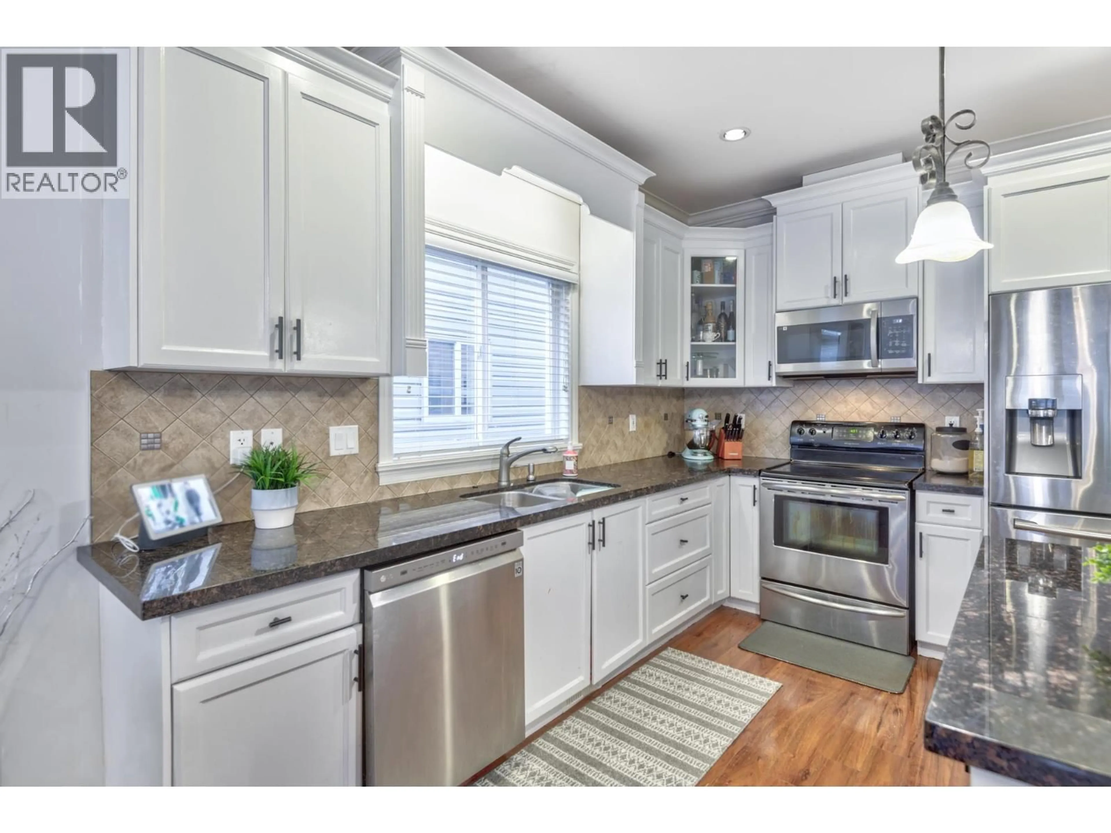 Open concept kitchen, ceramic/tile floor for 24284 101A AVENUE, Maple Ridge British Columbia V2W0C2