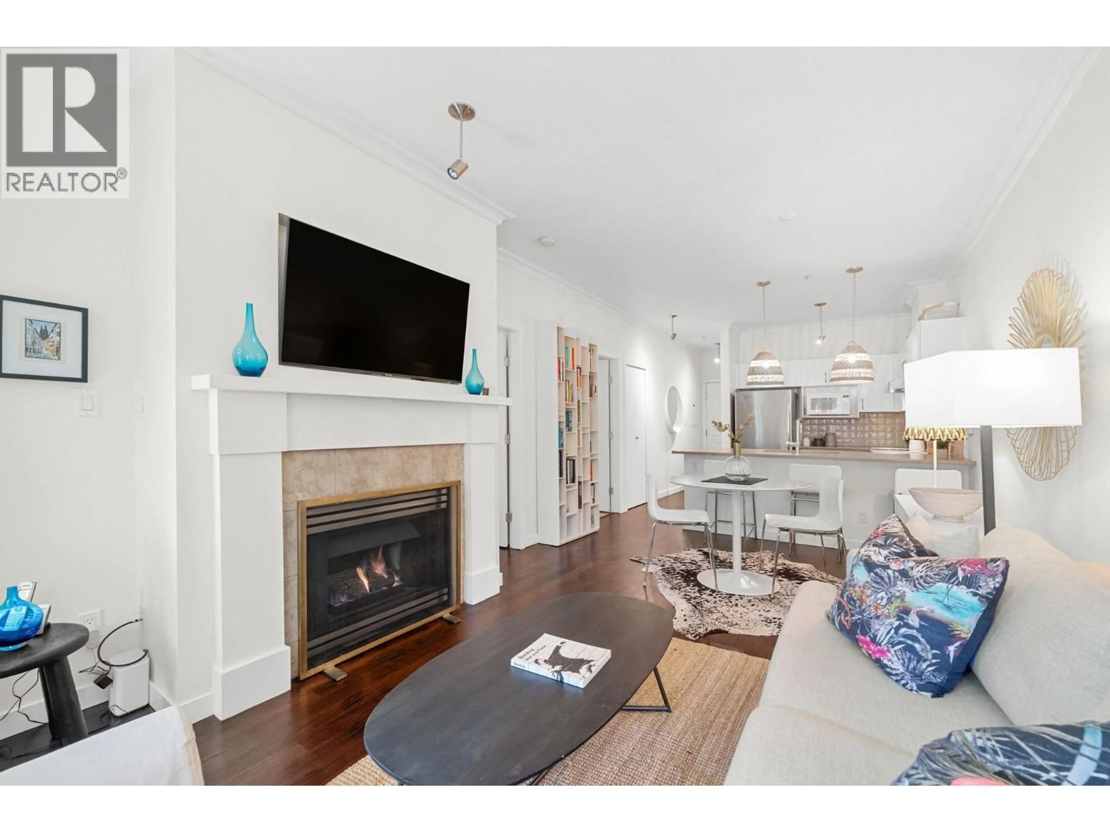 Living room with furniture, wood/laminate floor for 207 - 1388 NELSON STREET, Vancouver British Columbia V6E1J9