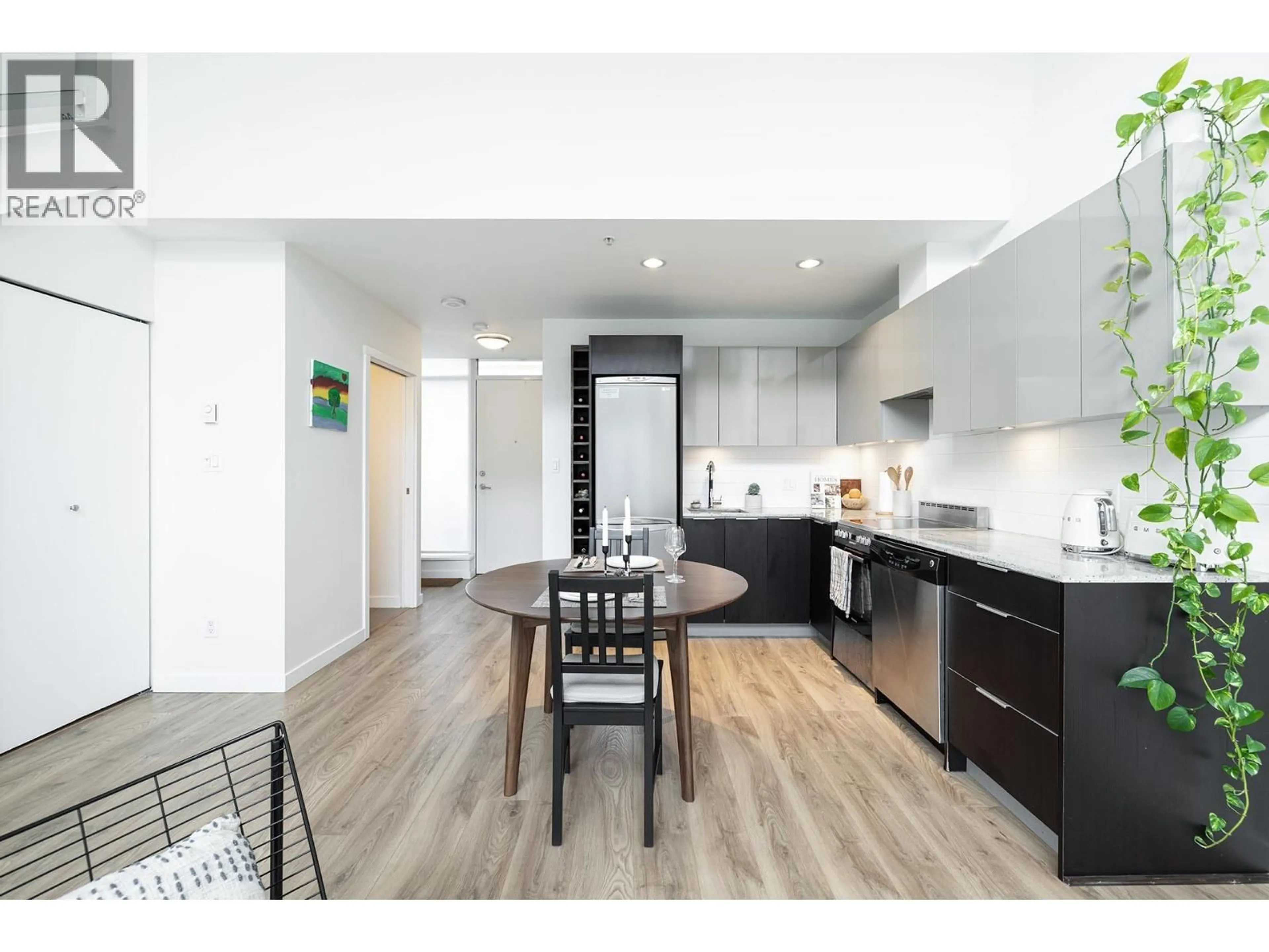 Open concept kitchen, wood/laminate floor for 310 - 429 2ND AVENUE, Vancouver British Columbia V5Y1E3