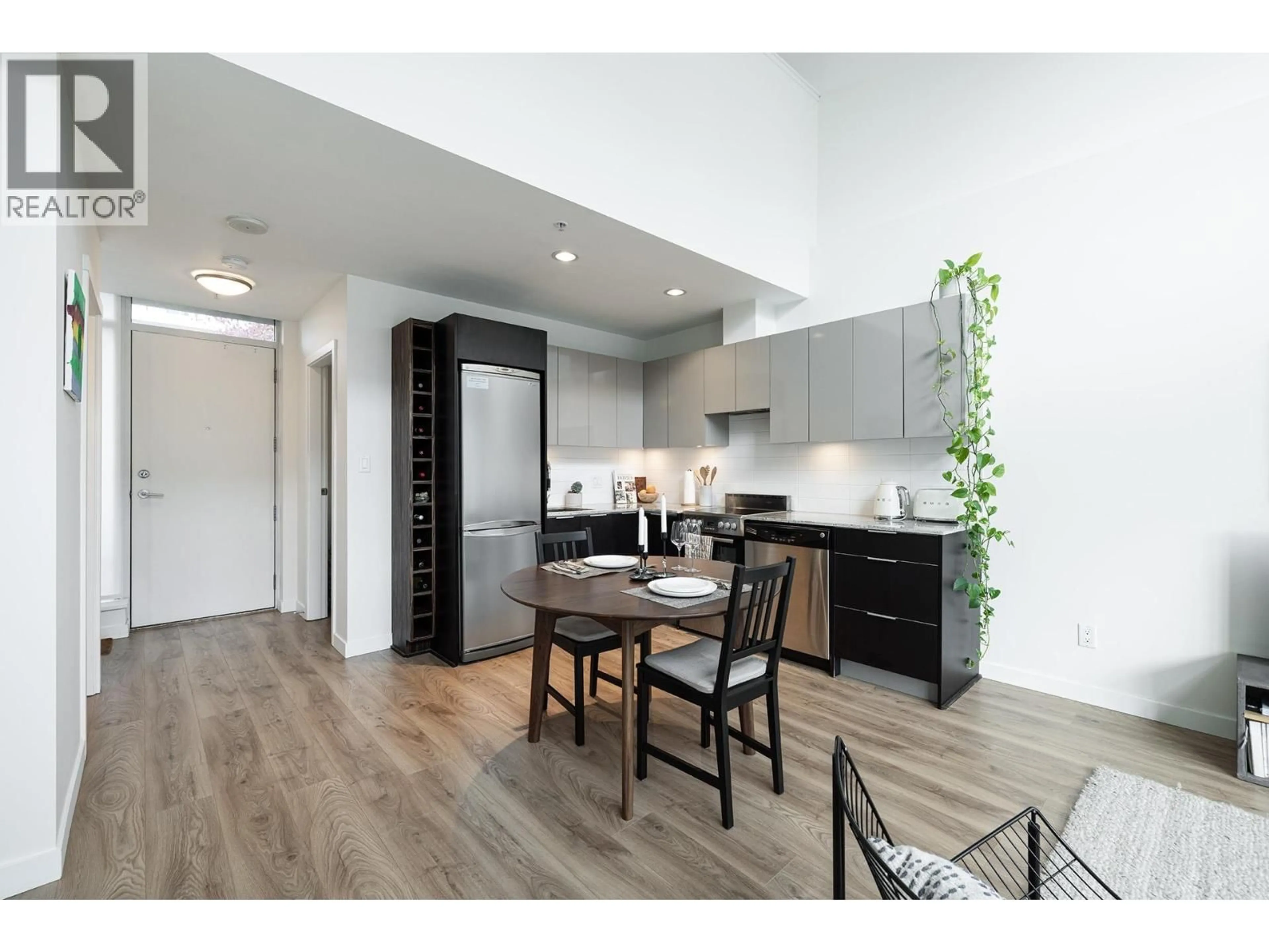 Open concept kitchen, wood/laminate floor for 310 - 429 2ND AVENUE, Vancouver British Columbia V5Y1E3