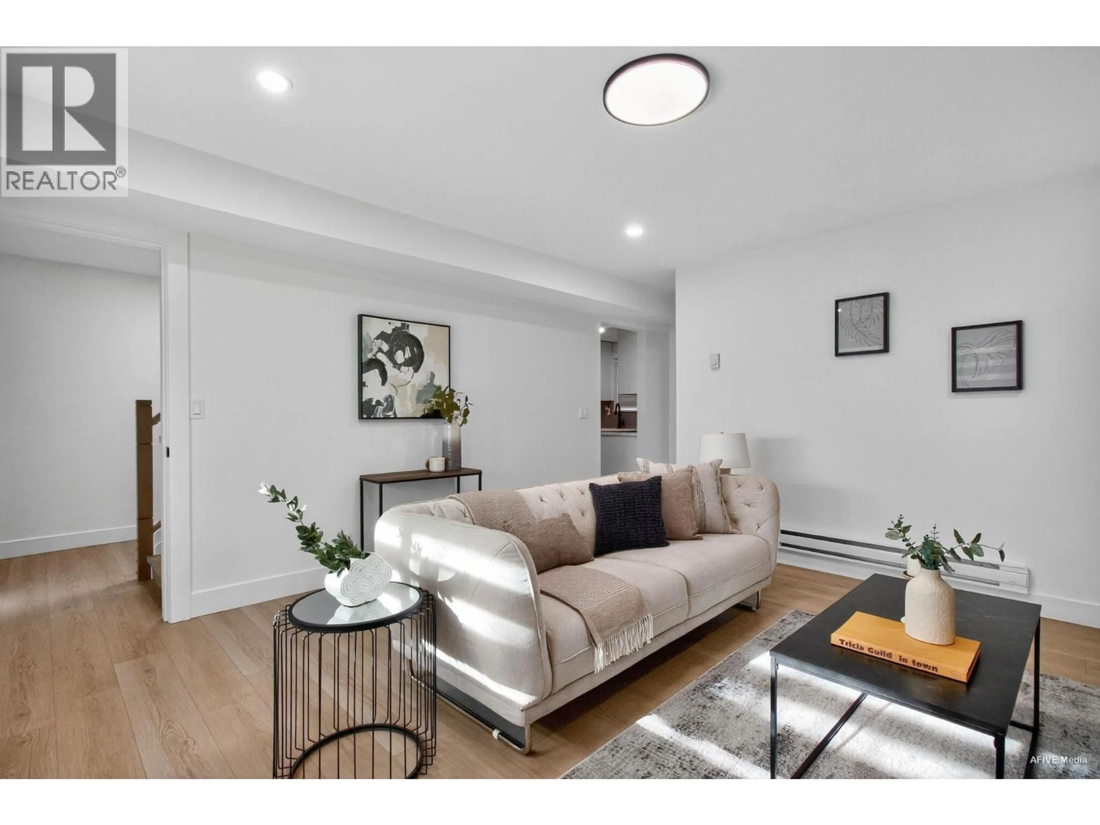 Living room with furniture, wood/laminate floor for 9831 GLENTHORNE DRIVE, Richmond British Columbia V7A1Y3
