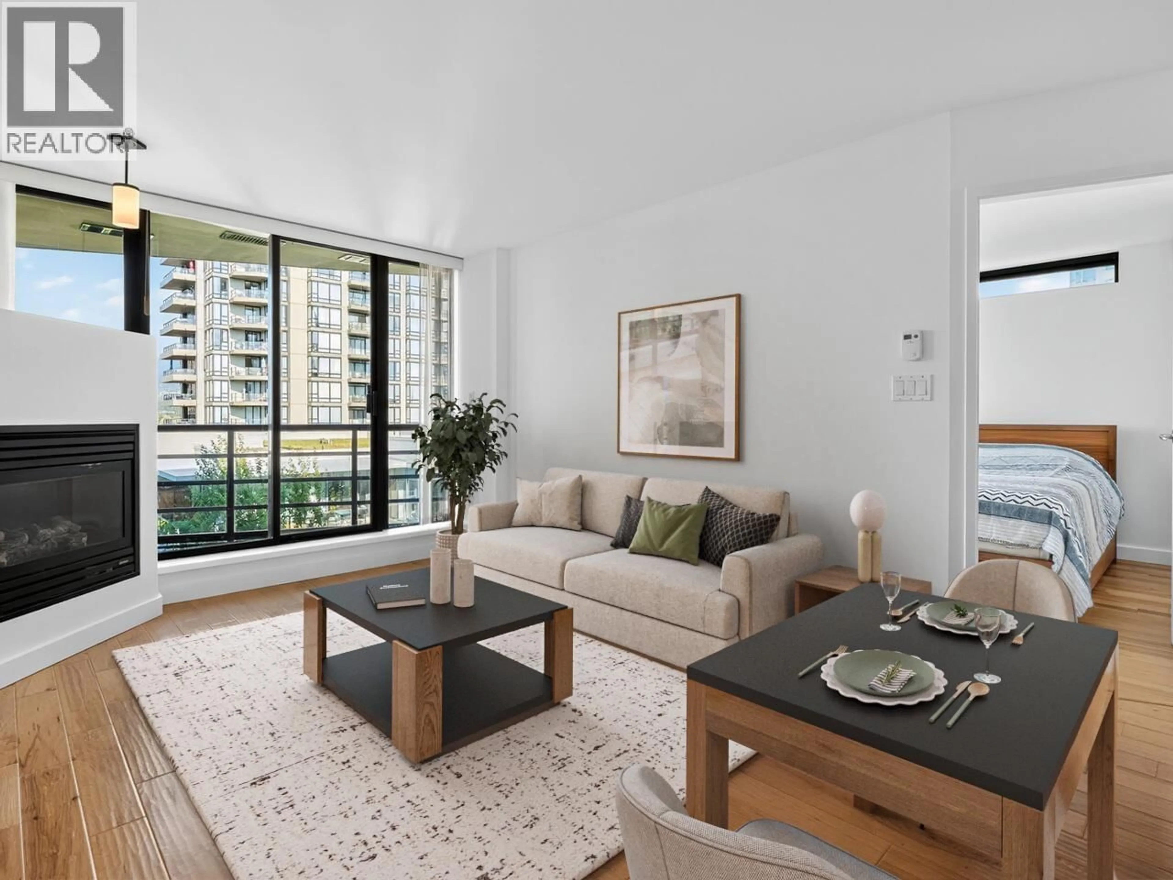 Living room with furniture, wood/laminate floor for 907 - 124 1ST STREET, North Vancouver British Columbia V7M3N3