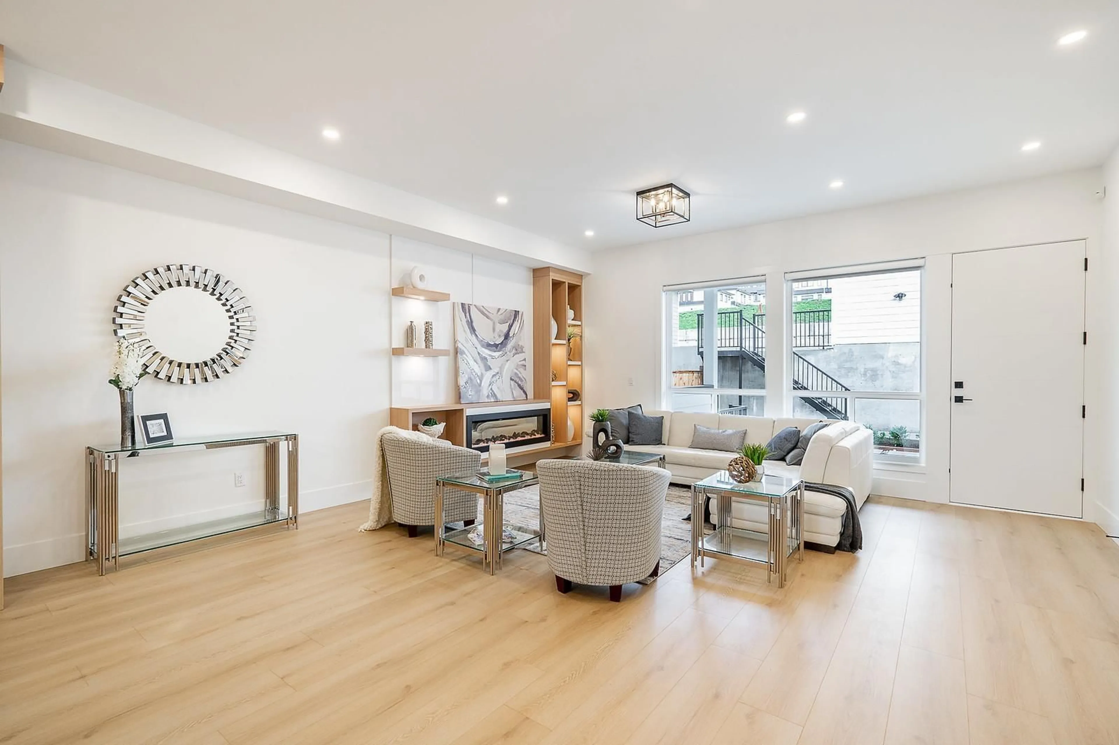 Living room with furniture, wood/laminate floor for 16673 16, Surrey British Columbia V3S0X7