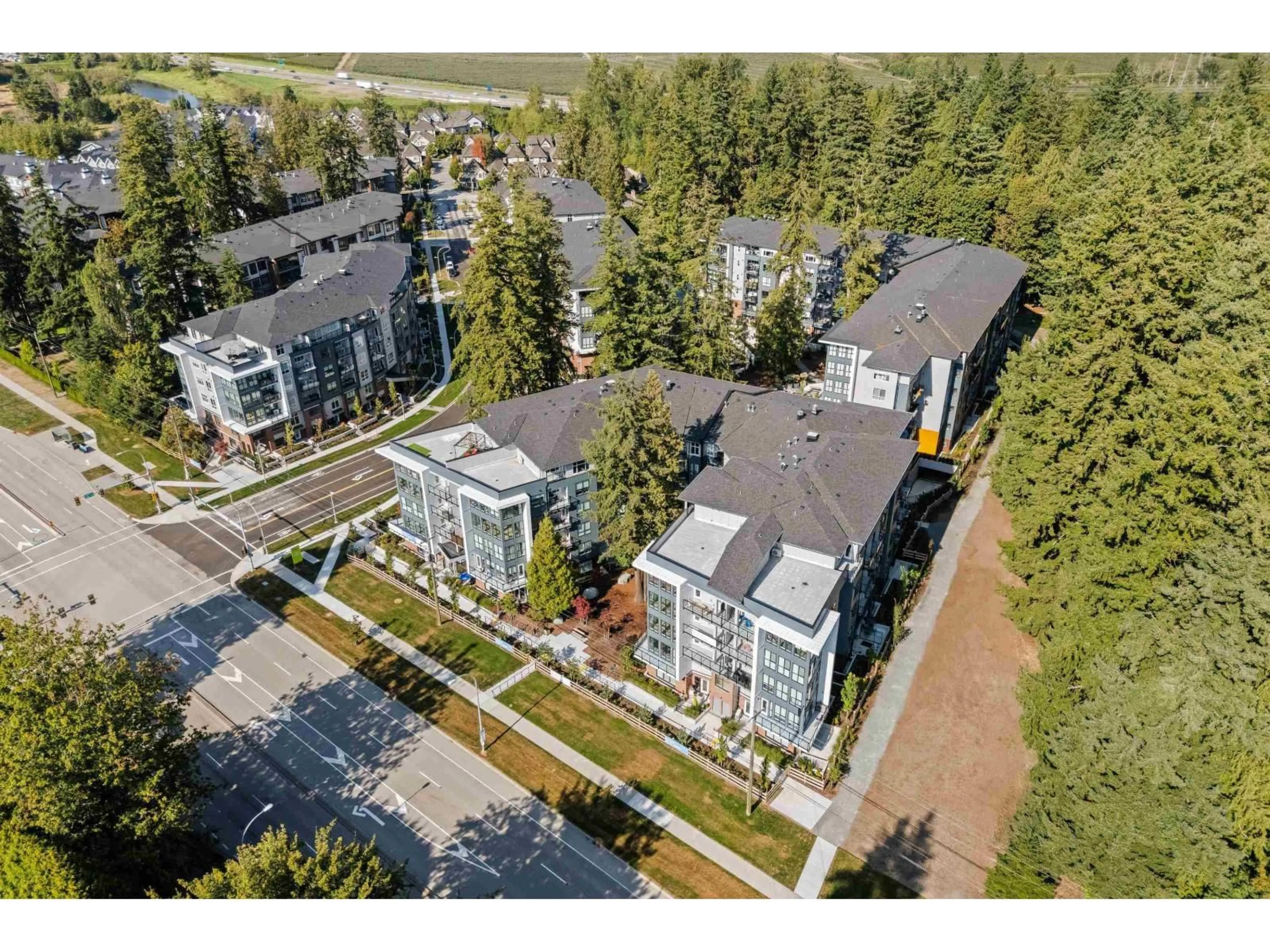 A pic from outside/outdoor area/front of a property/back of a property/a pic from drone, unknown for #309 - 3438 146A, Surrey British Columbia V0V0V0
