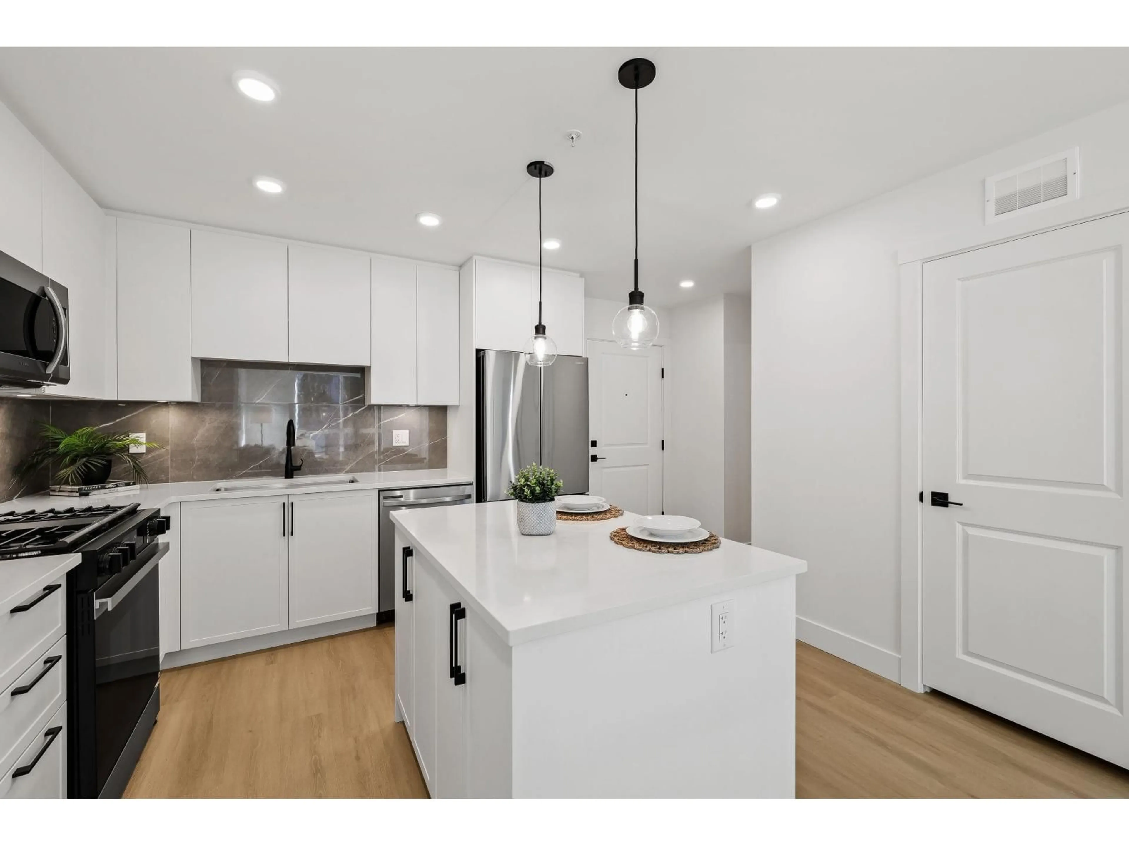 Open concept kitchen, unknown for #309 - 3438 146A STREET, Surrey British Columbia V0V0V0