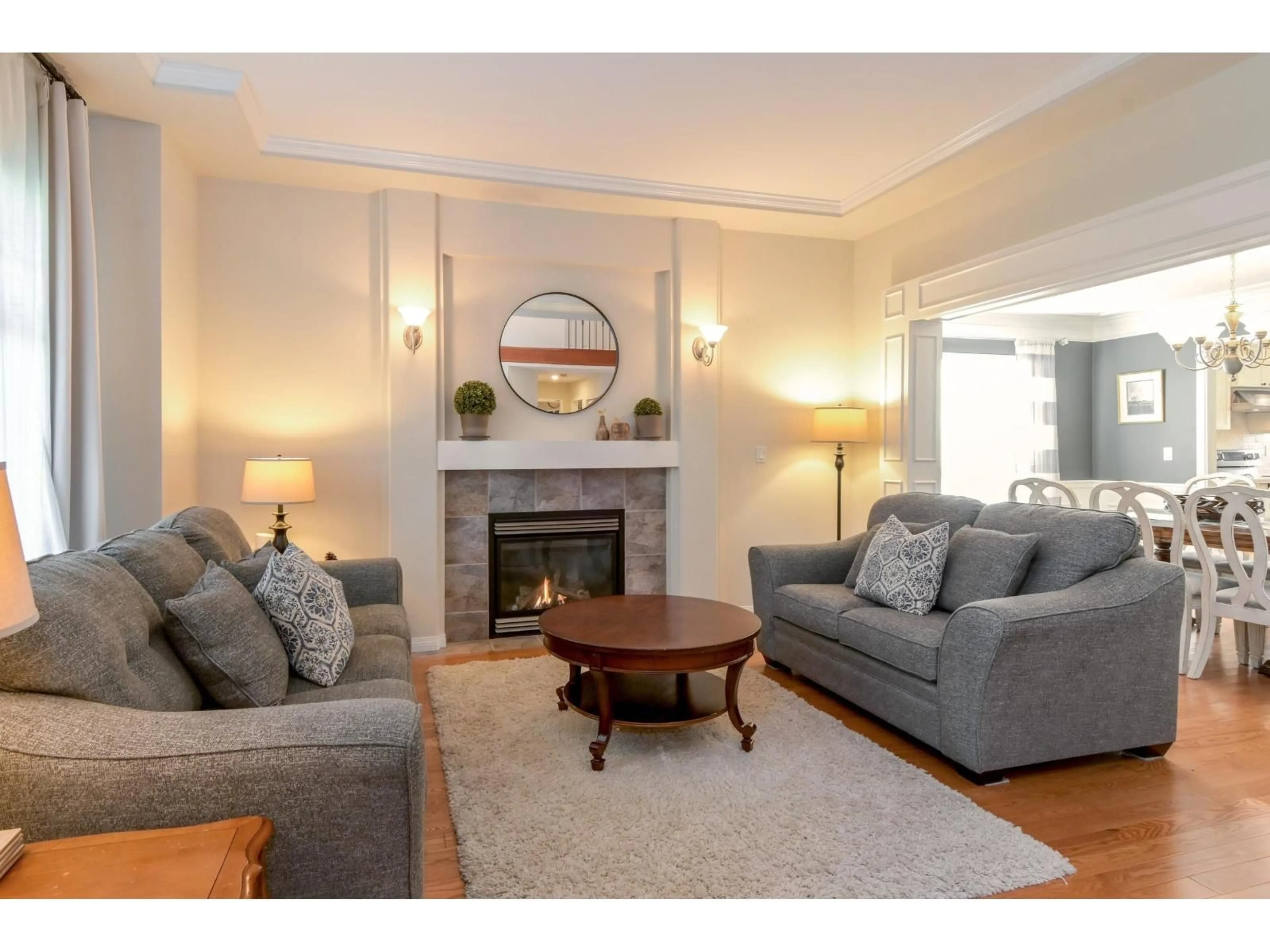 Living room with furniture, wood/laminate floor for 18290 CLAYTONWOOD CRESCENT, Surrey British Columbia V3S0M3