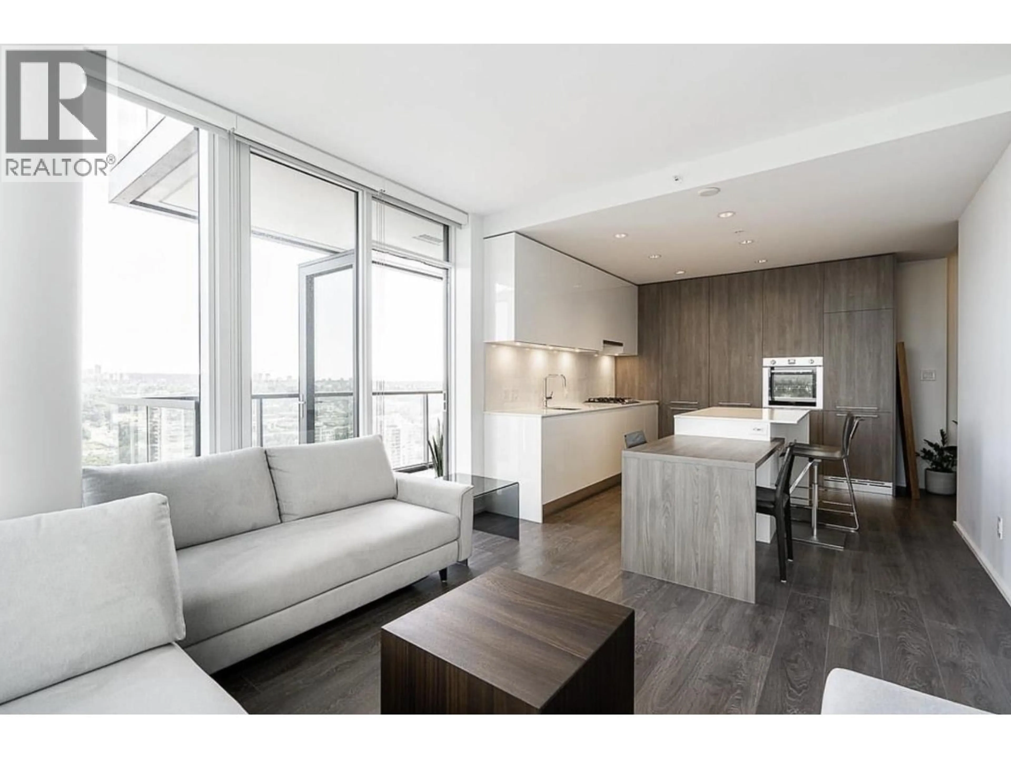 Living room with furniture, wood/laminate floor for 3102 - 1955 ALPHA WAY, Burnaby British Columbia V5C0K6