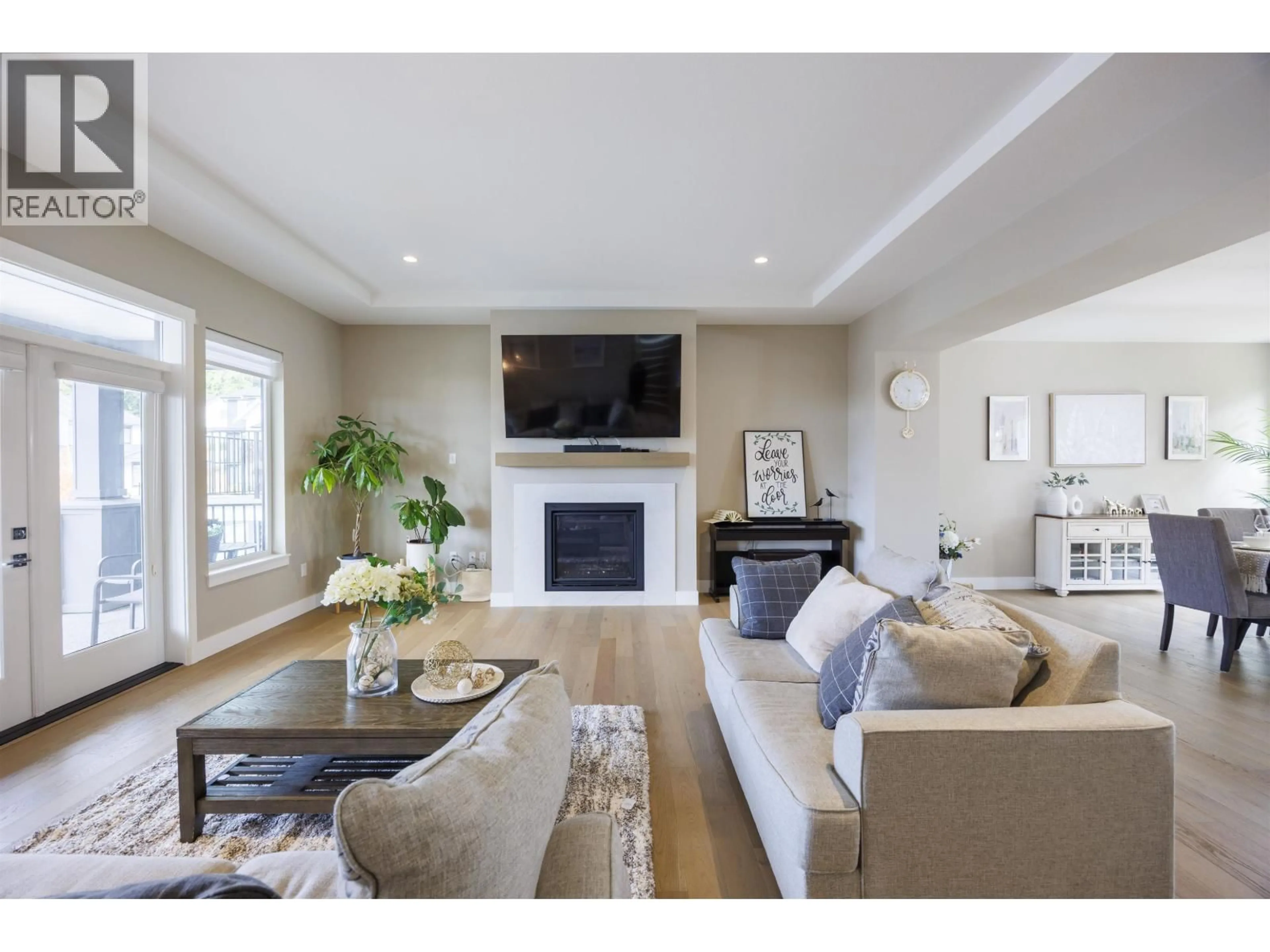 Living room with furniture, wood/laminate floor for 1441 NYSTROM COURT, Coquitlam British Columbia V3E0N5