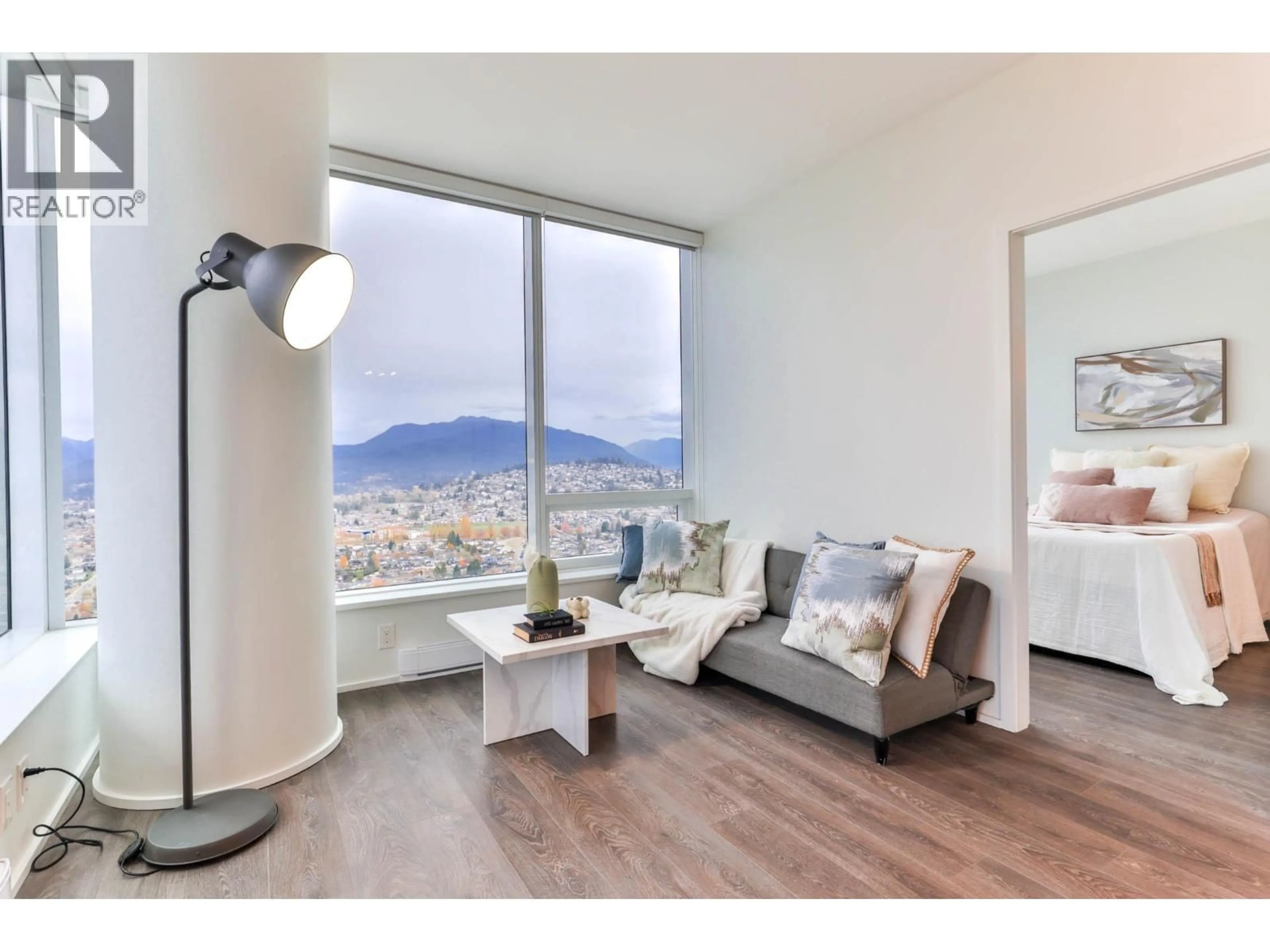 Living room with furniture, wood/laminate floor for 5006 - 1955 ALPHA WAY, Burnaby British Columbia V5C0K6