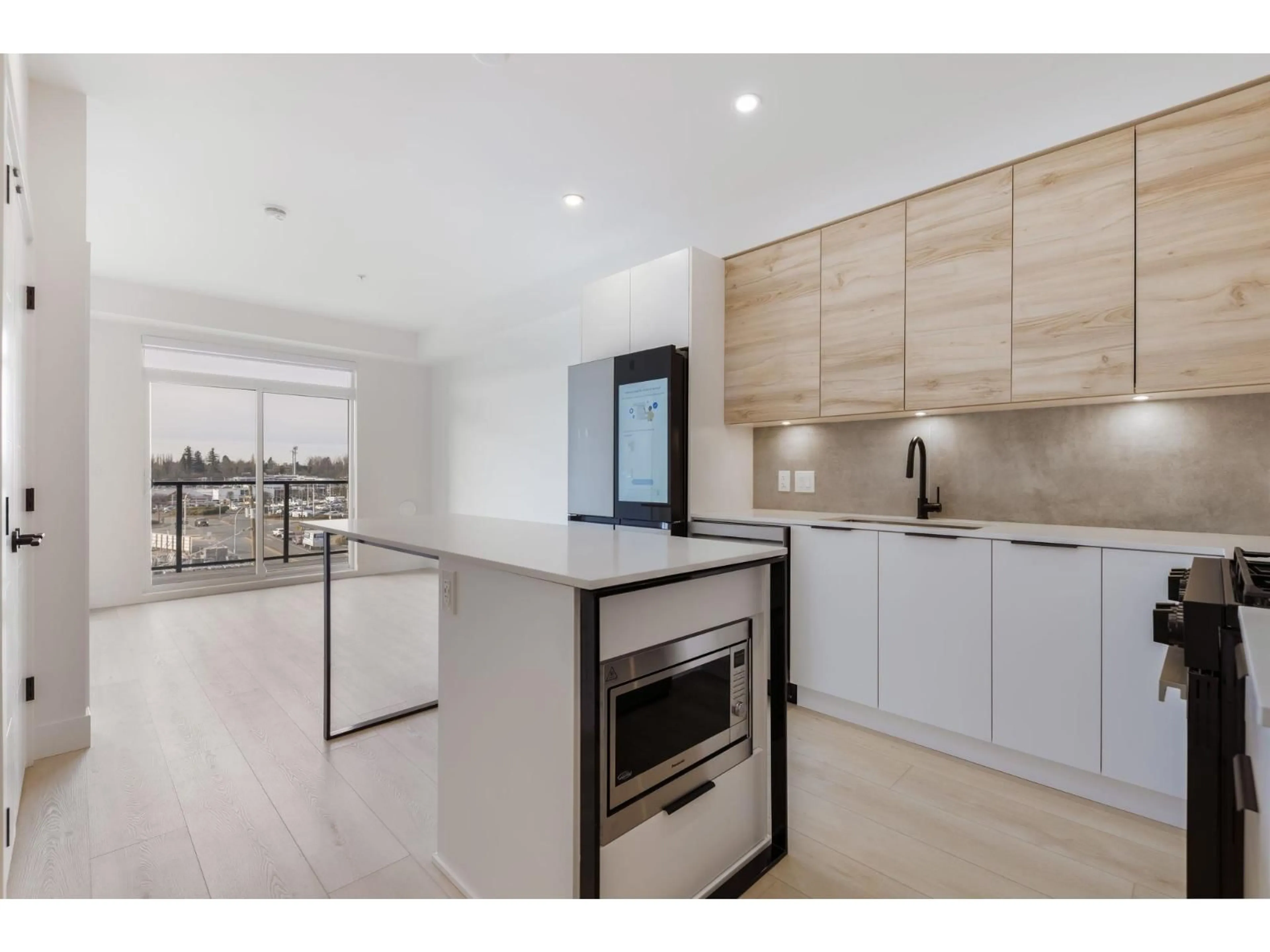 Open concept kitchen, wood/laminate floor for 303 - 30520 CARDINAL, Abbotsford British Columbia V2T0C5