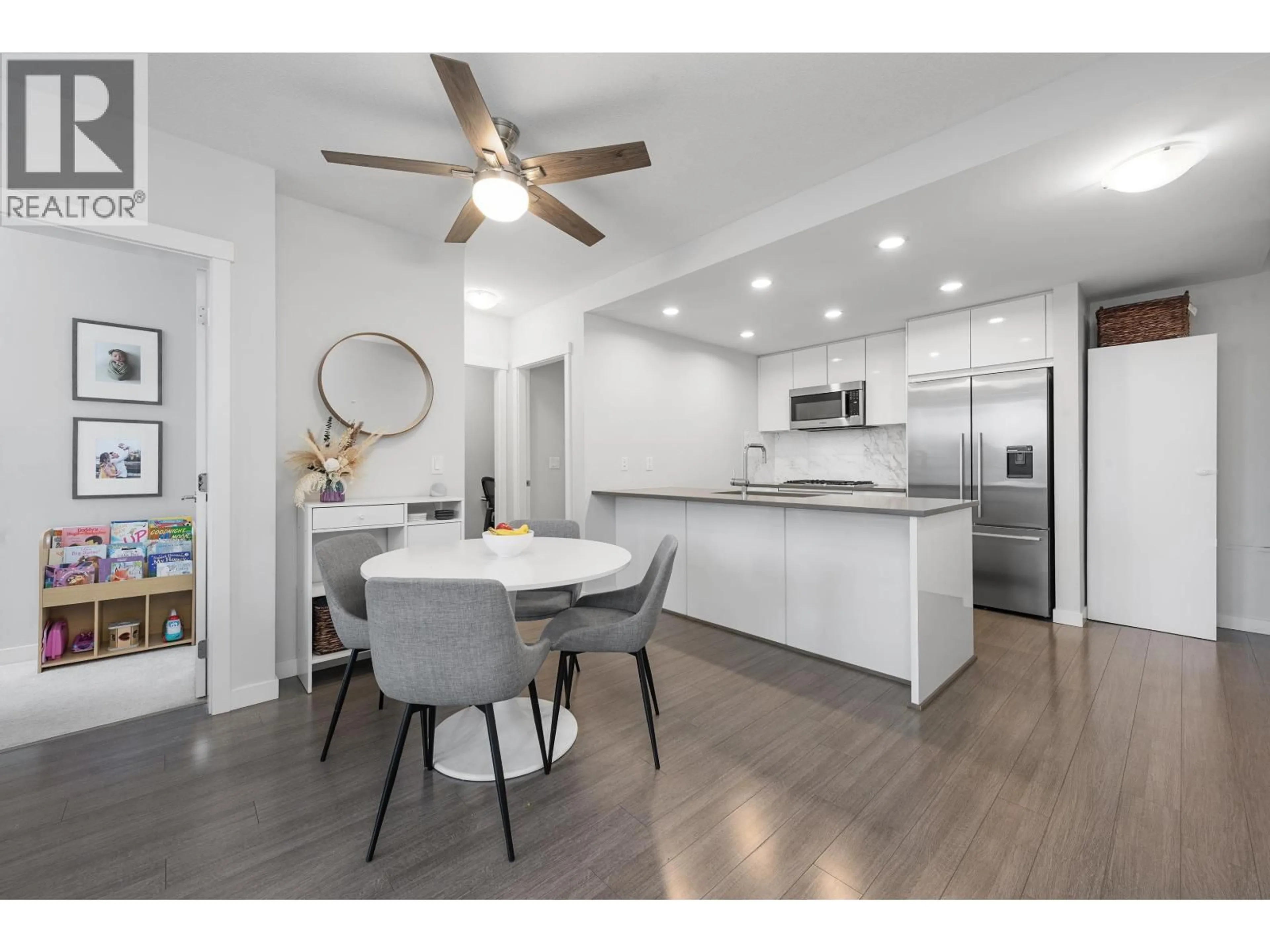 Open concept kitchen, wood/laminate floor for 511 - 3281 KENT AVENUE NORTH AVENUE, Vancouver British Columbia V5S0C4