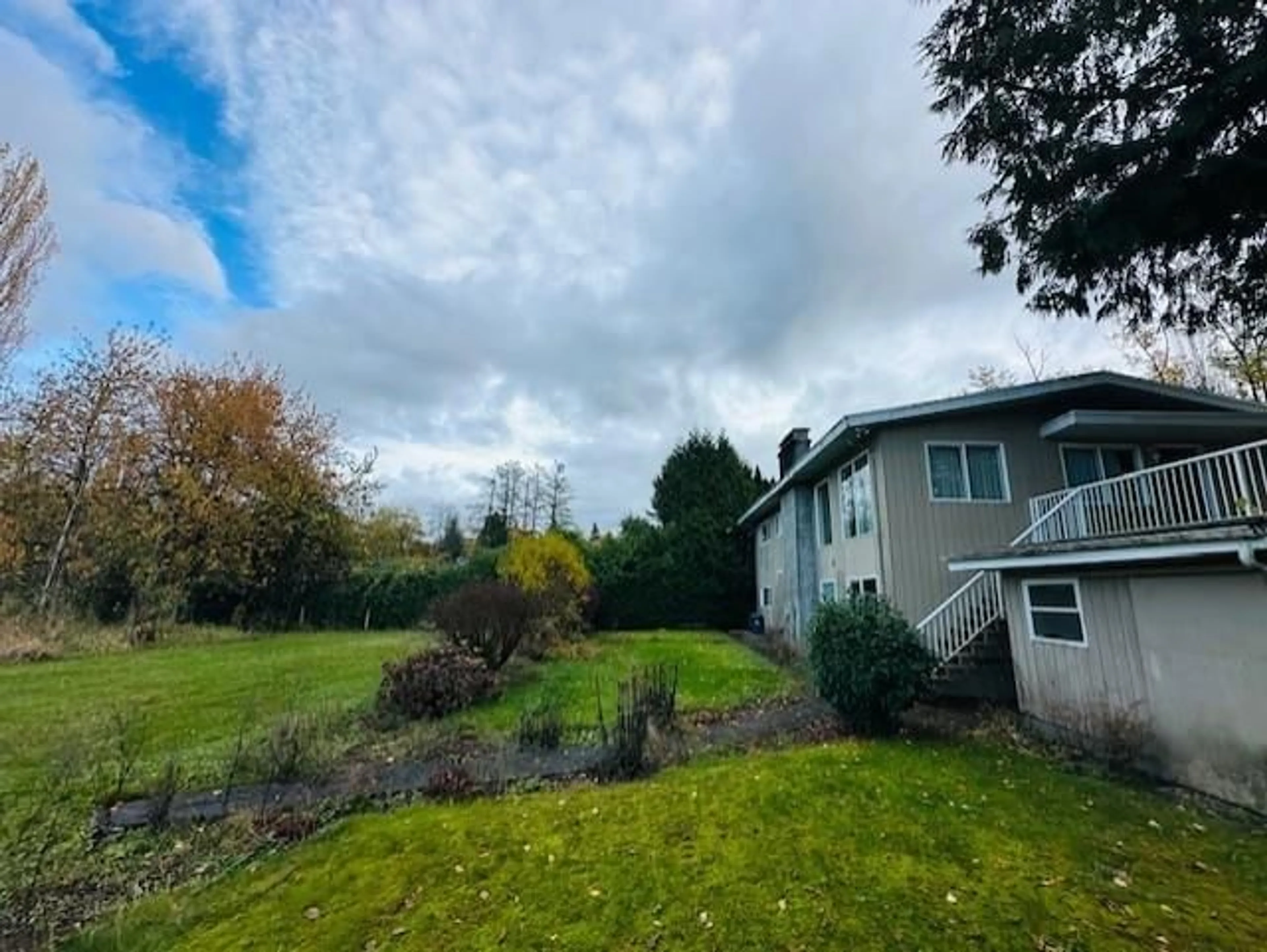A pic from outside/outdoor area/front of a property/back of a property/a pic from drone, unknown for 18351 74, Surrey British Columbia V4N6C1