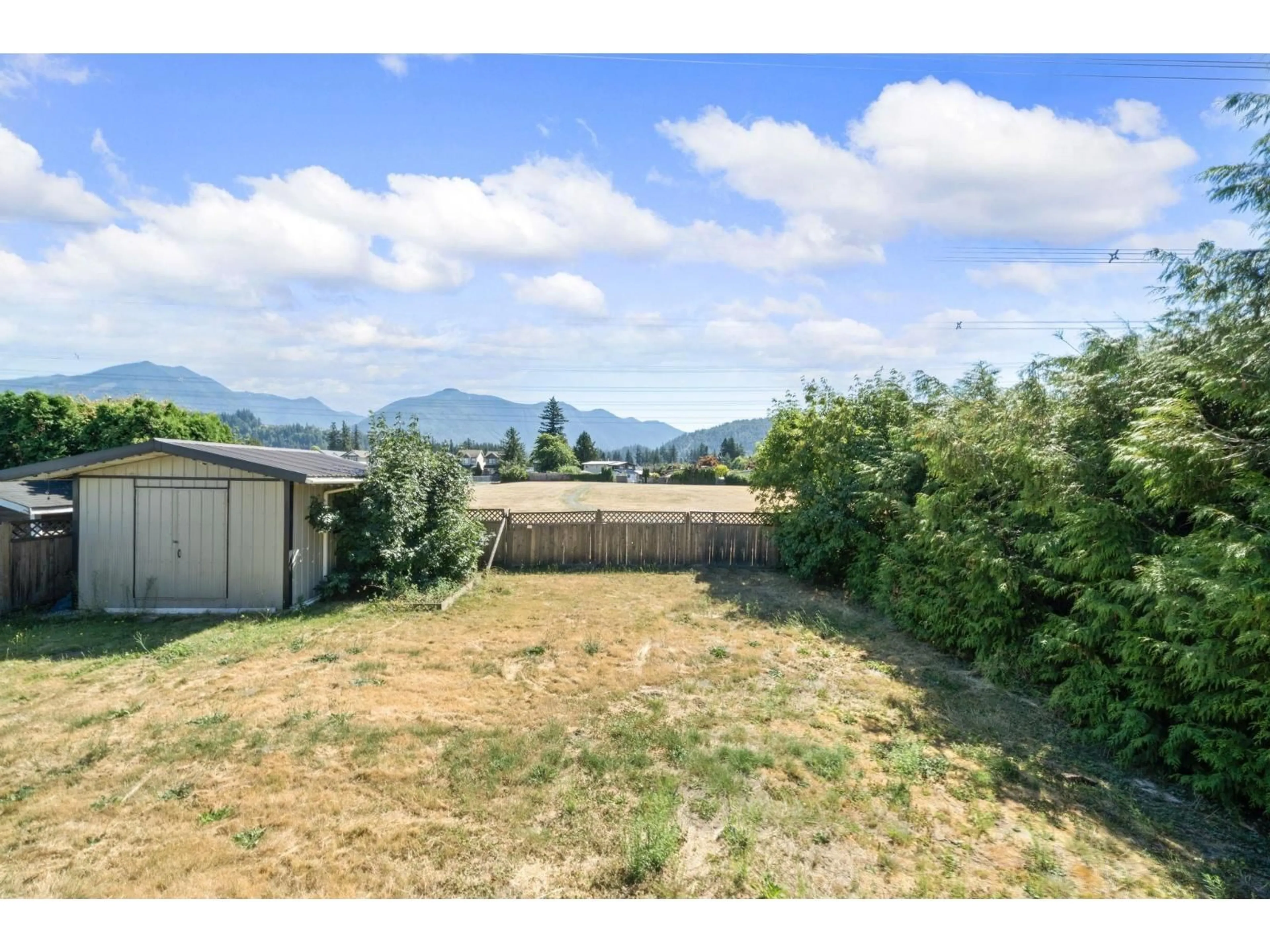 A pic from outside/outdoor area/front of a property/back of a property/a pic from drone, mountain view for 45266 BALMORAL AVENUE, Chilliwack British Columbia V2R3G9