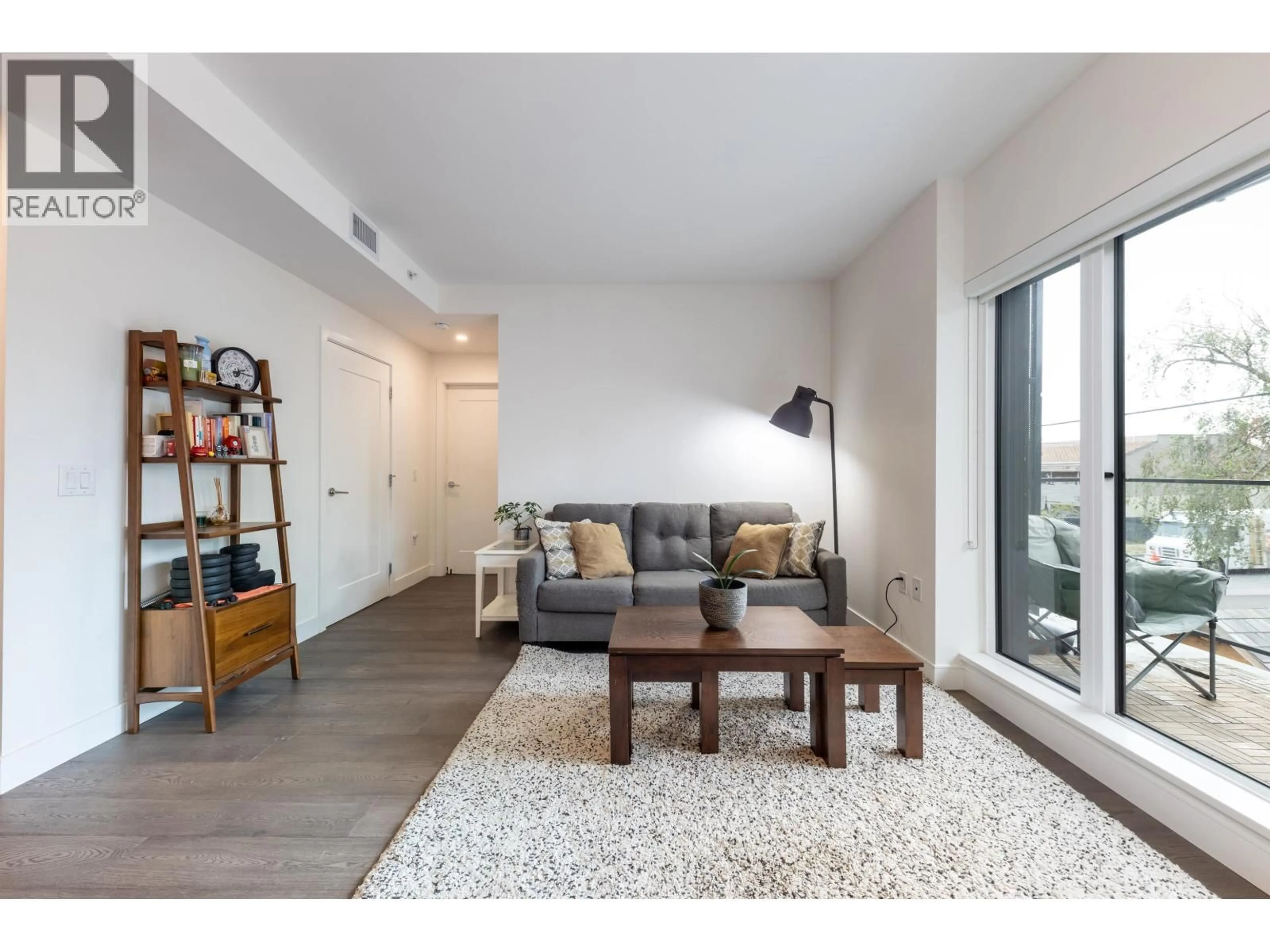 Living room with furniture, wood/laminate floor for 202 - 477 59TH AVENUE, Vancouver British Columbia V5X1X4