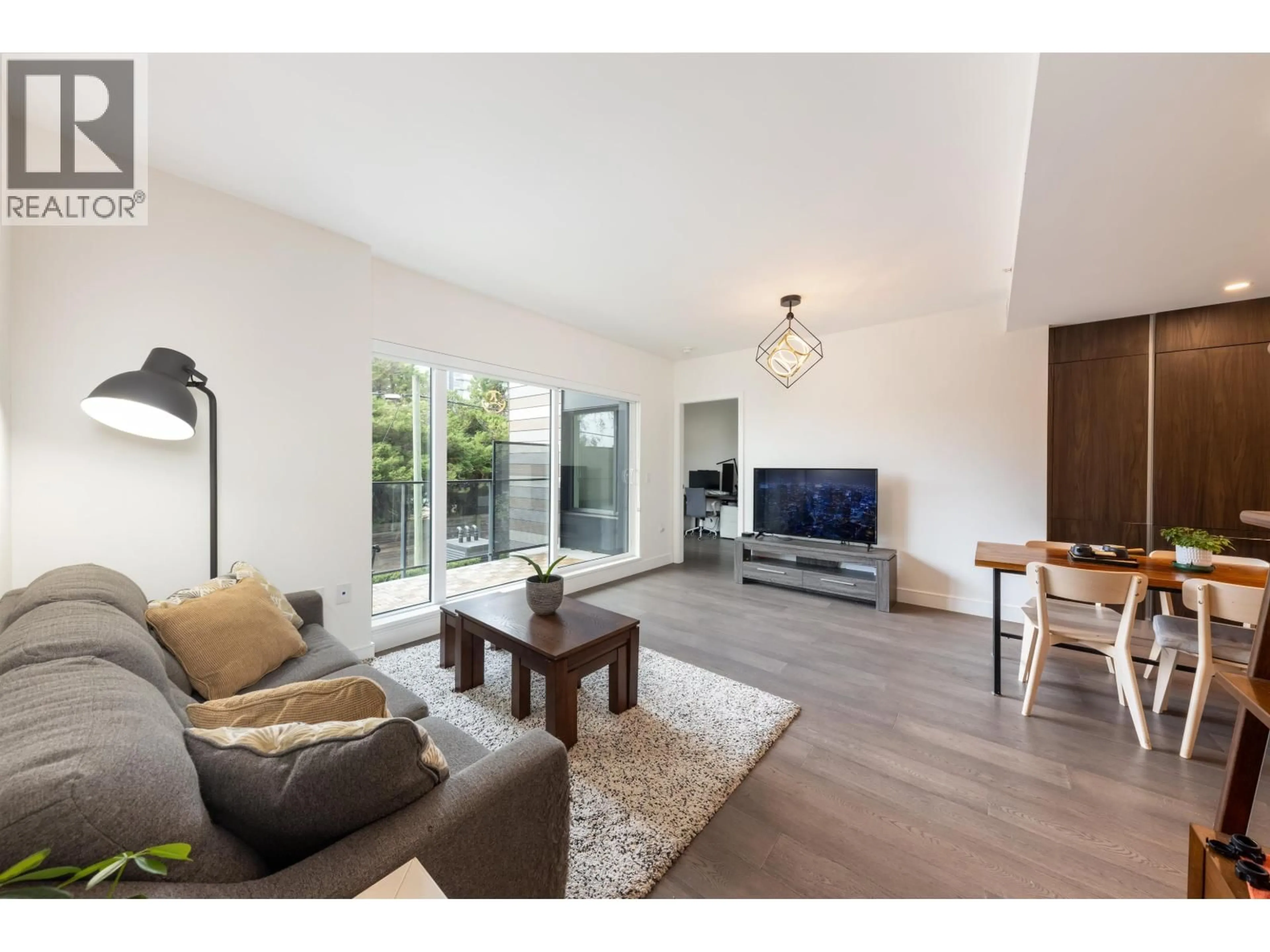 Living room with furniture, wood/laminate floor for 202 - 477 59TH AVENUE, Vancouver British Columbia V5X1X4
