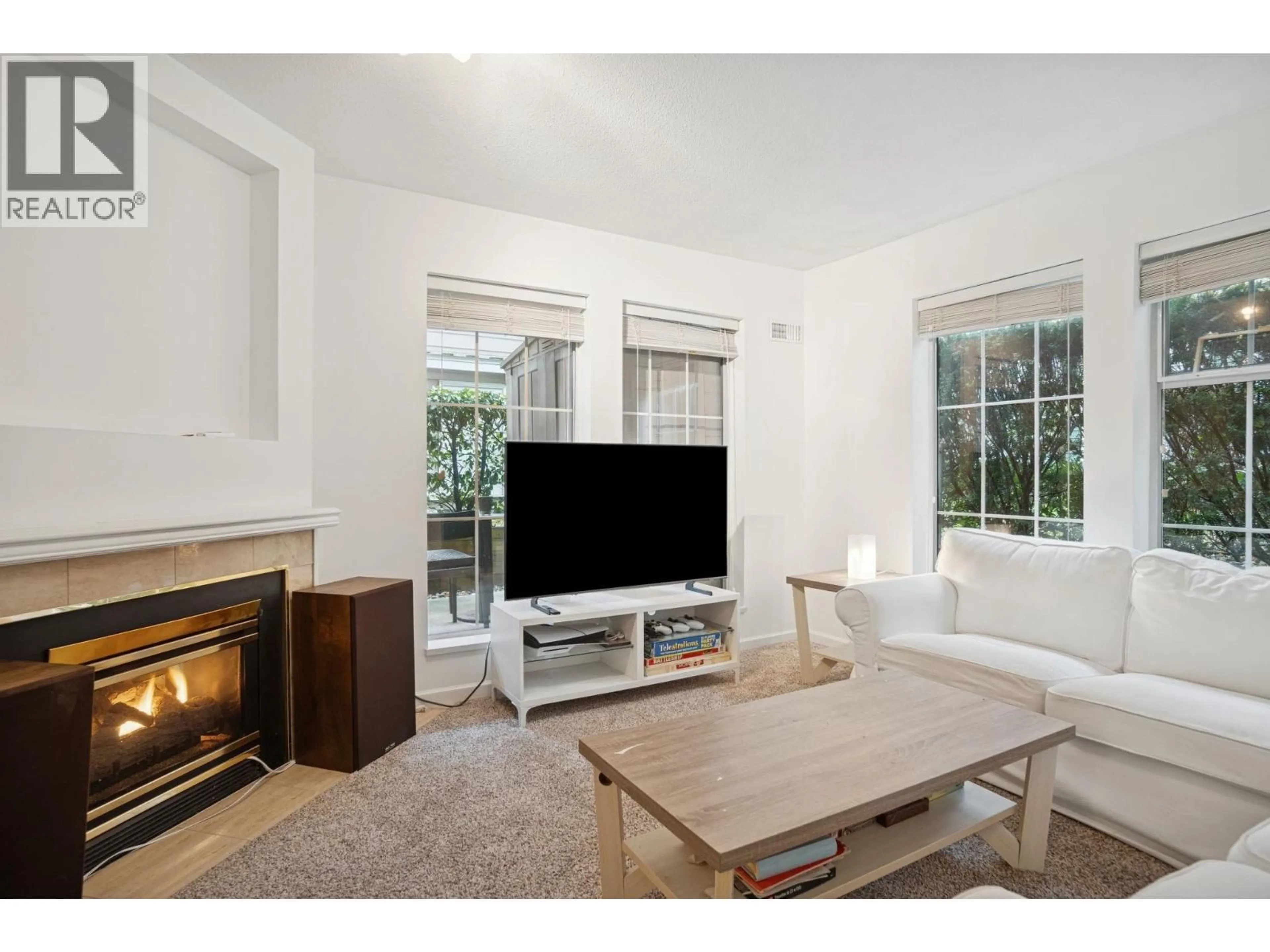 Living room with furniture, wood/laminate floor for 102 - 1199 WESTWOOD STREET, Coquitlam British Columbia V3B7P6