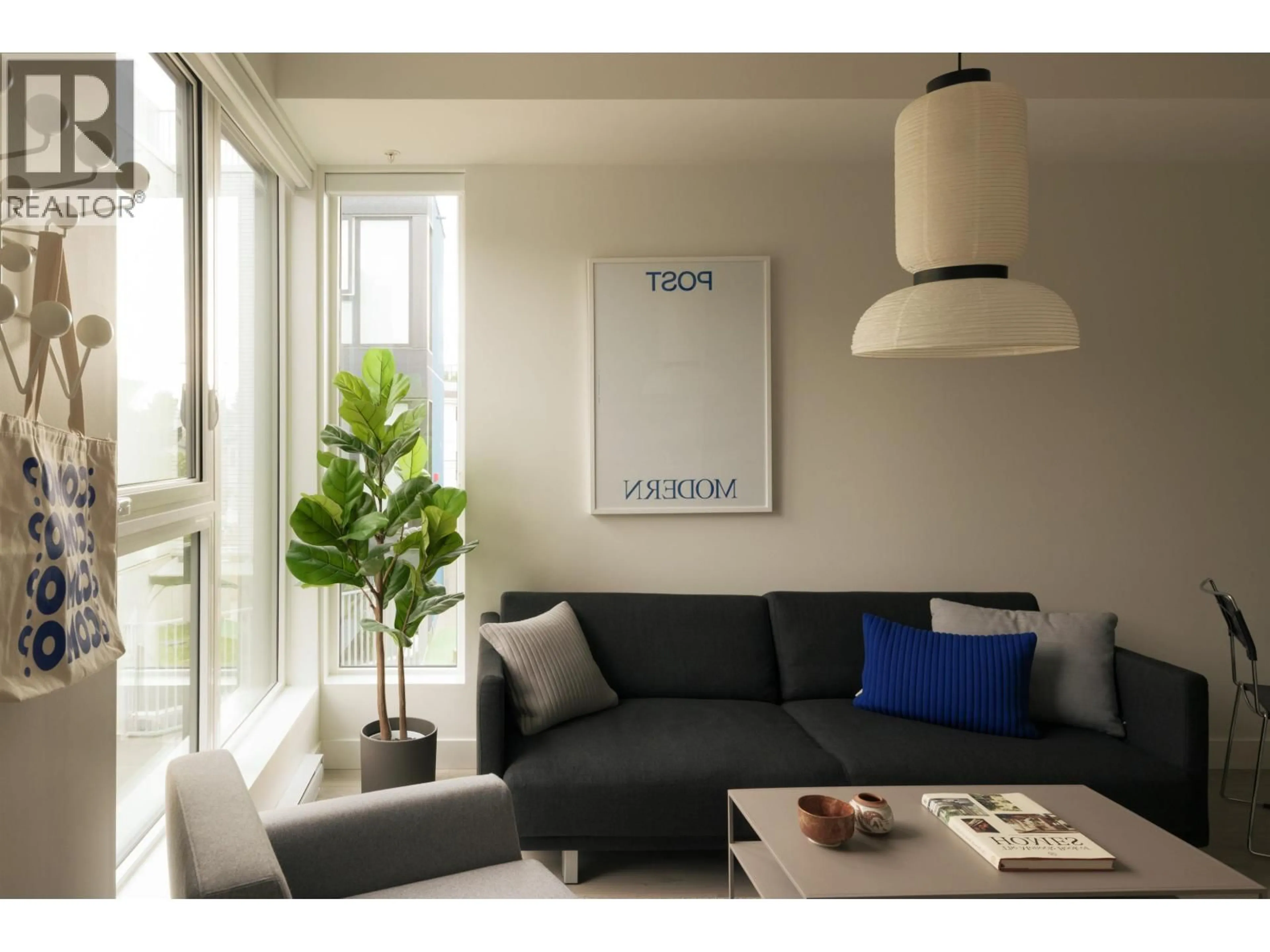 Living room with furniture, wood/laminate floor for 215 - 322 15TH AVENUE, Vancouver British Columbia V5T0K5