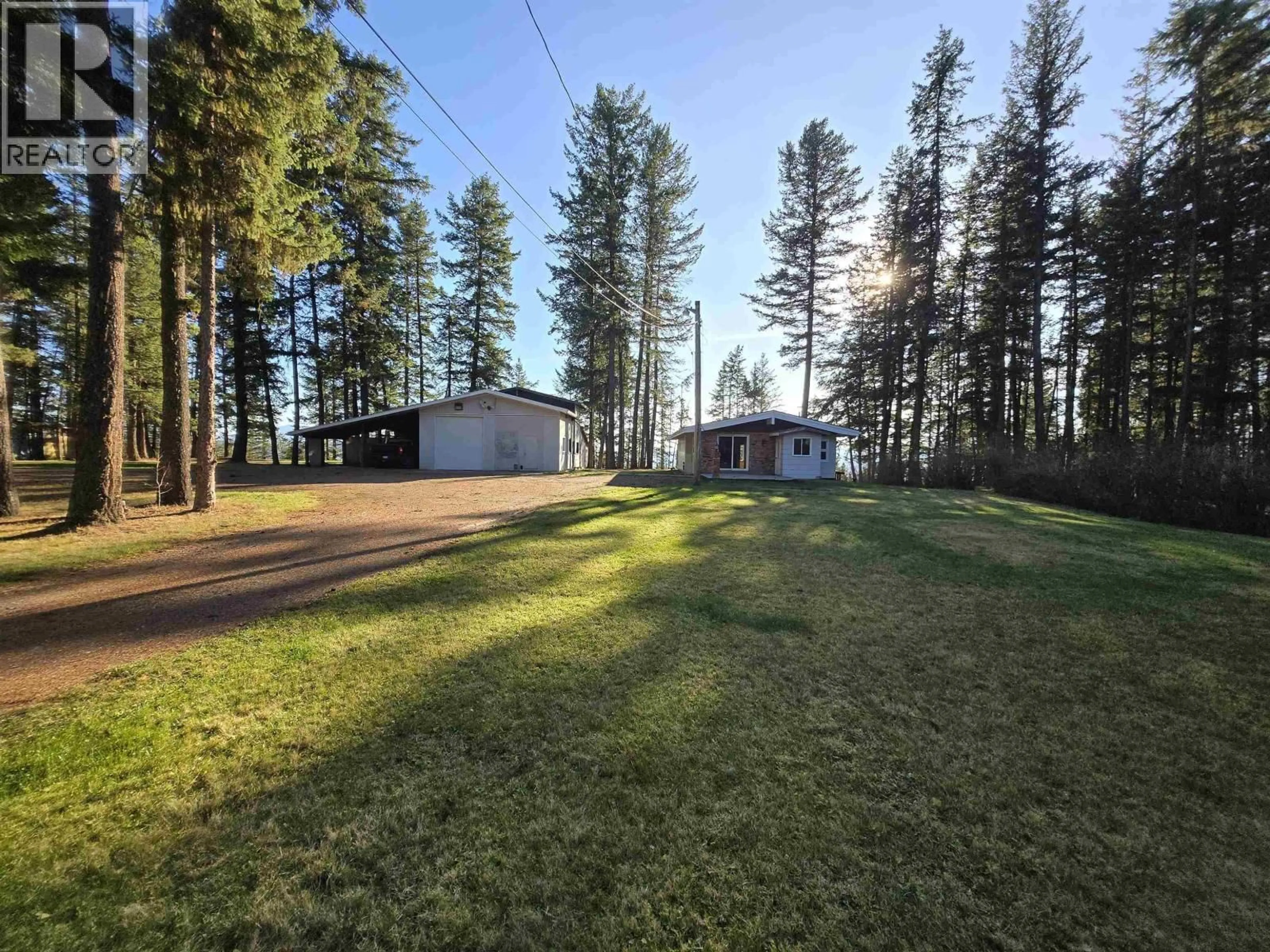 A pic from outside/outdoor area/front of a property/back of a property/a pic from drone, forest/trees view for 706 CALLIS ROAD, Quesnel British Columbia V2J6S3