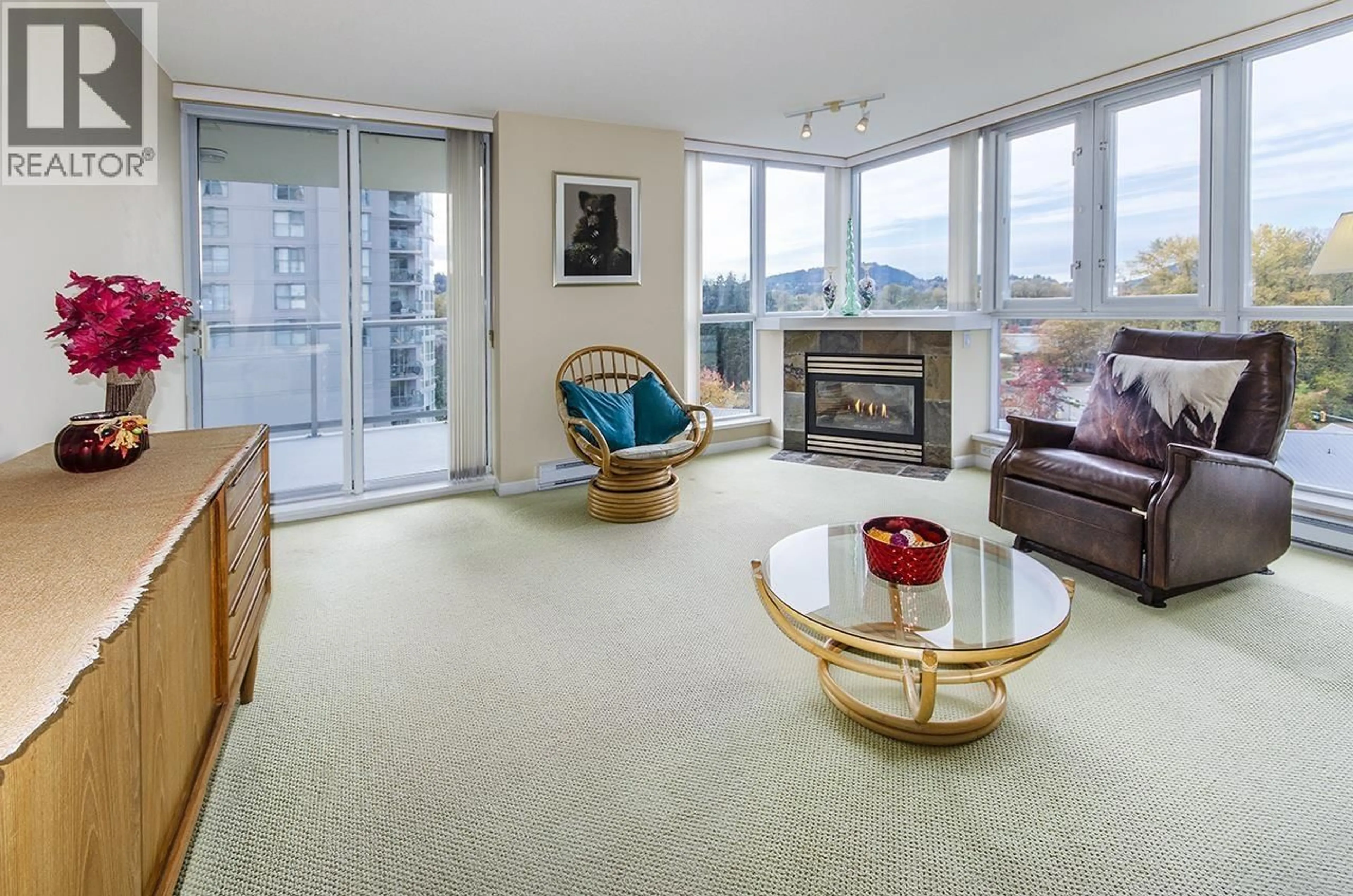 Living room with furniture, carpet floor for 701 - 235 GUILDFORD WAY, Port Moody British Columbia V3H5L8