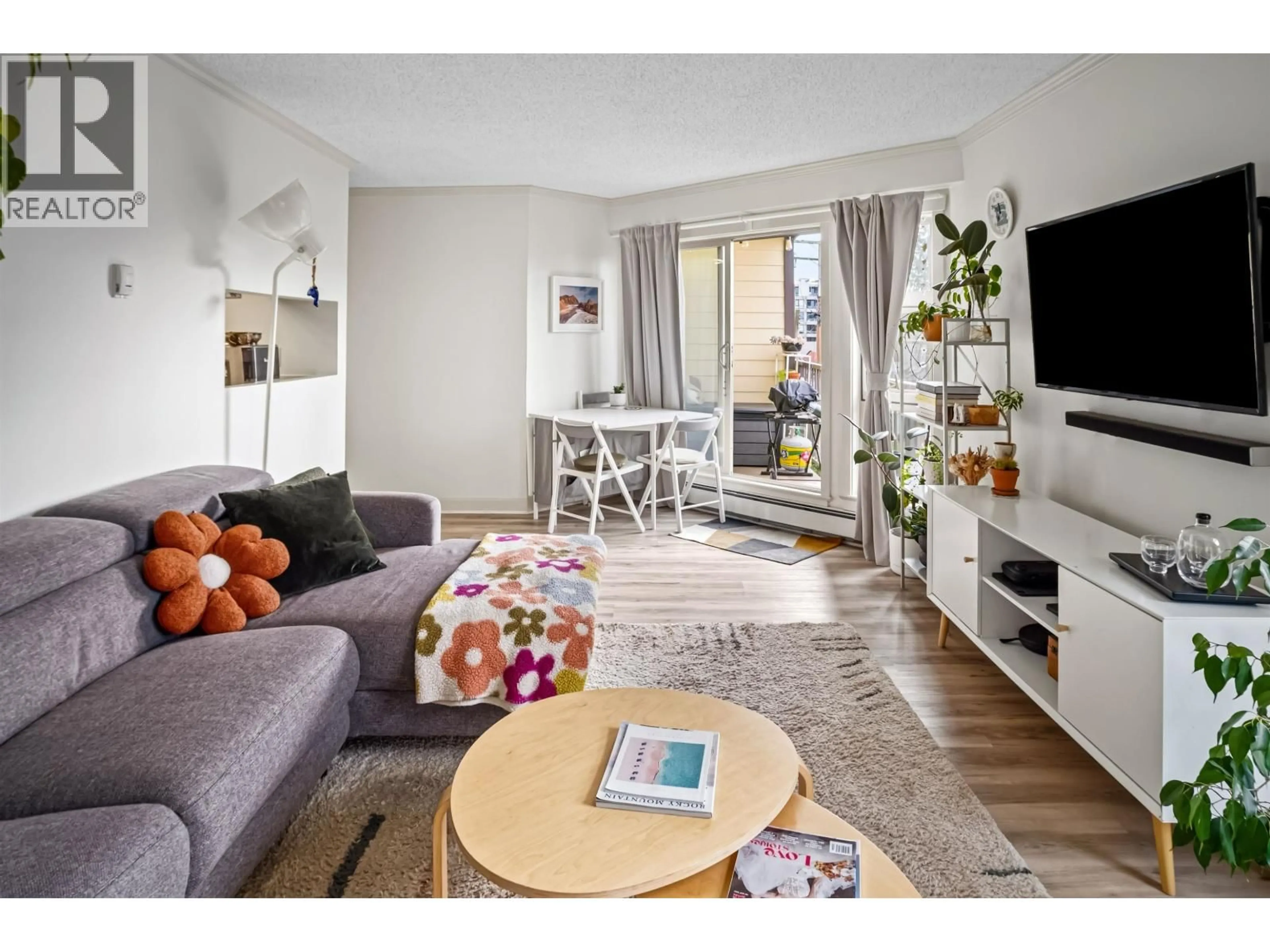 Living room with furniture, wood/laminate floor for 205 - 235 W 4TH STREET, North Vancouver British Columbia V7M1H8