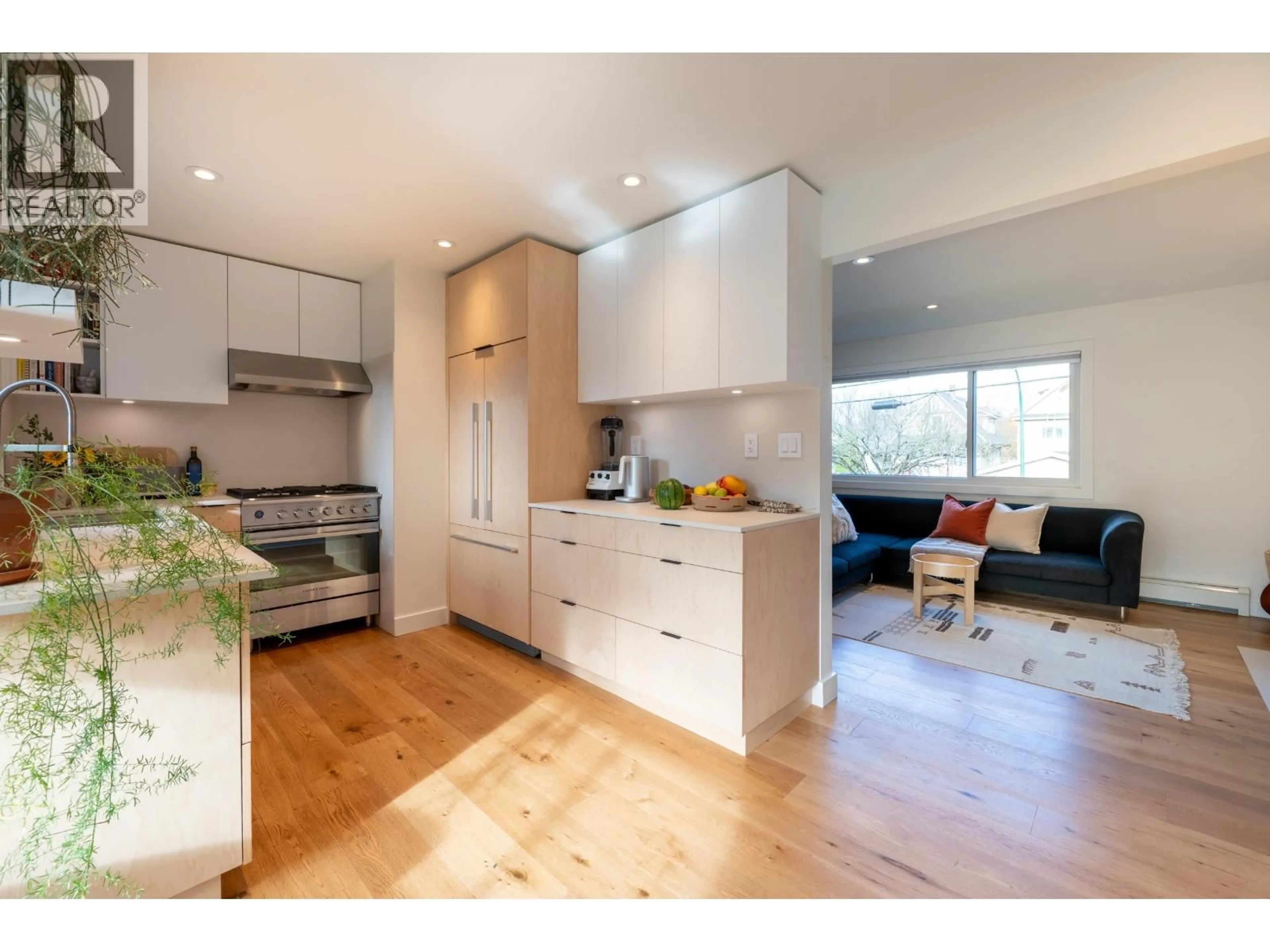 Open concept kitchen, wood/laminate floor for 2254 FERNDALE STREET, Vancouver British Columbia V5L1Y5