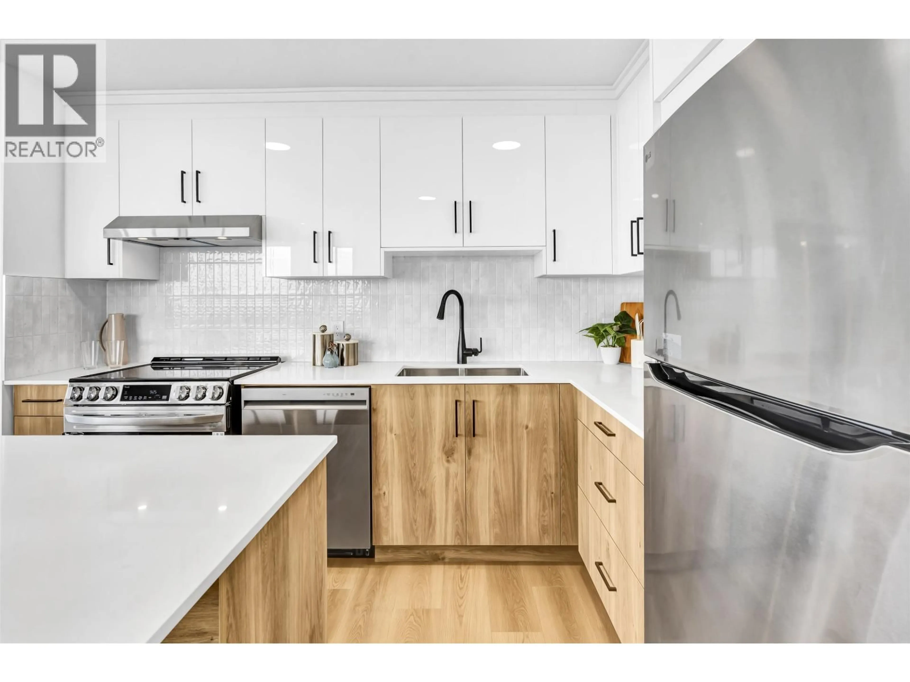 Open concept kitchen, wood/laminate floor for 2003 - 6540 BURLINGTON AVENUE, Burnaby British Columbia V5H4G3