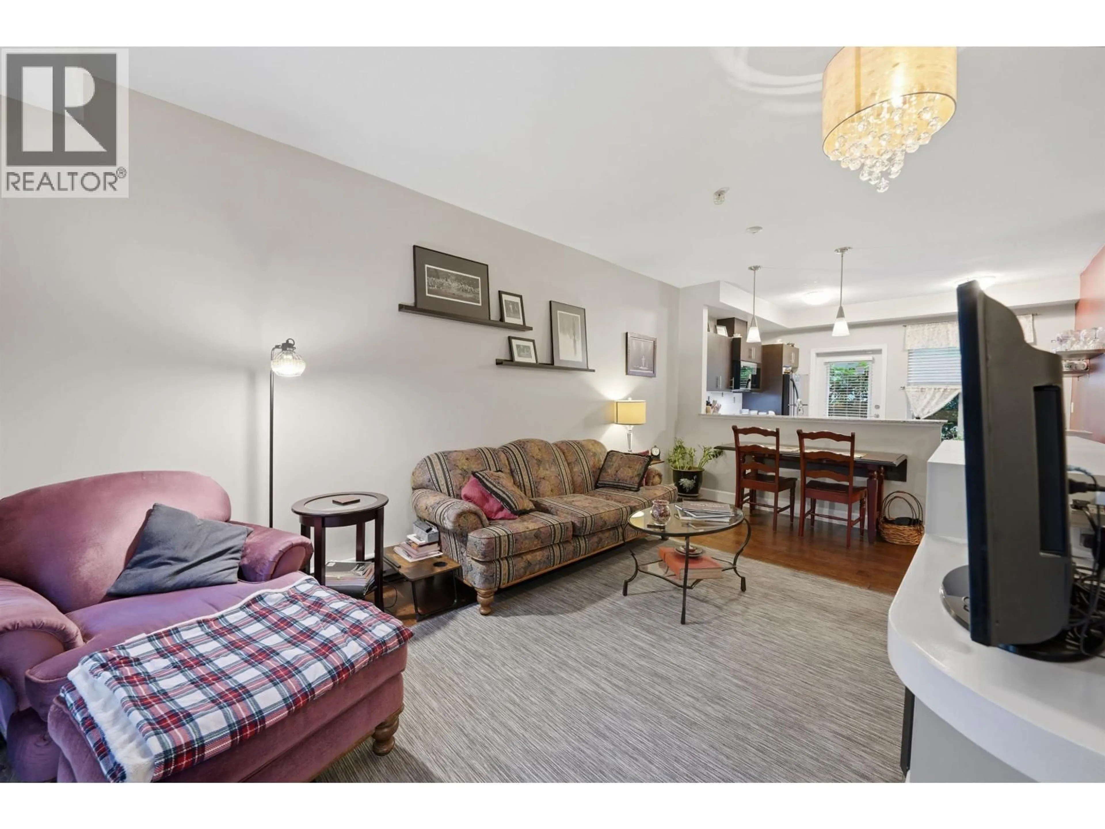 Living room with furniture, unknown for 117 - 2108 ROWLAND STREET, Port Coquitlam British Columbia V3C0C1